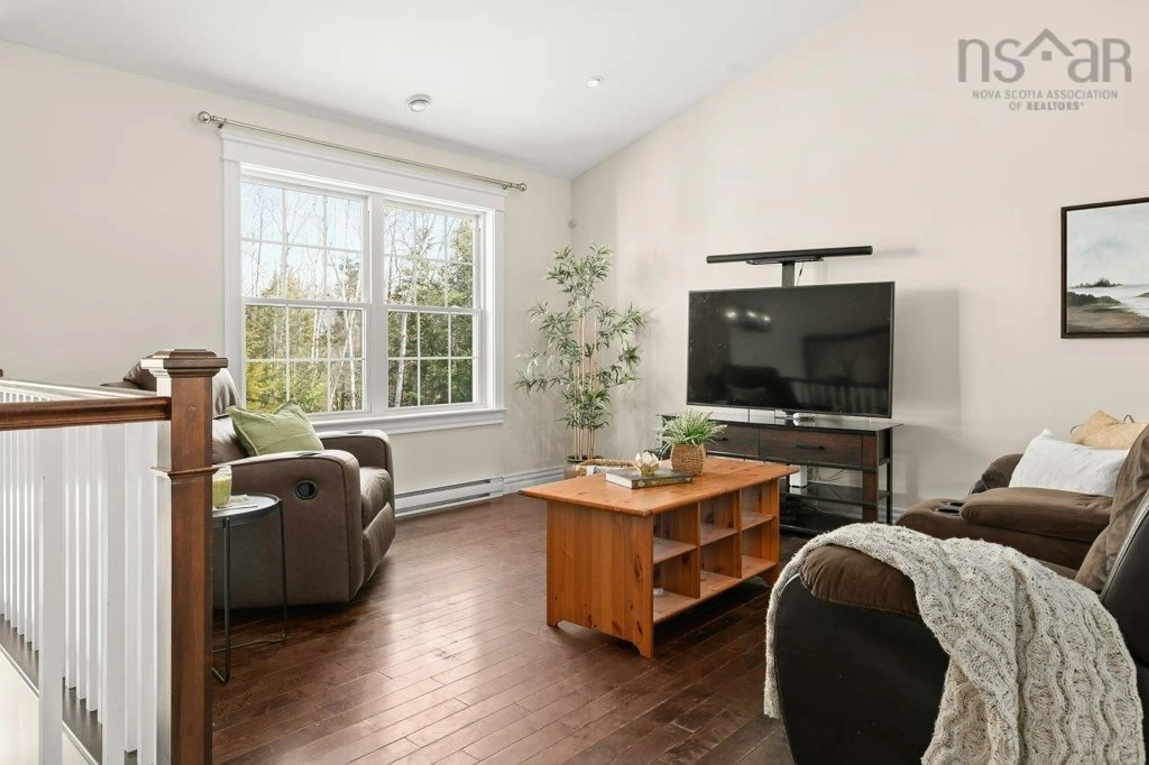 Living room with furniture, wood/laminate floor for 166 Sawgrass Dr, Oakfield Nova Scotia B2T 0E9