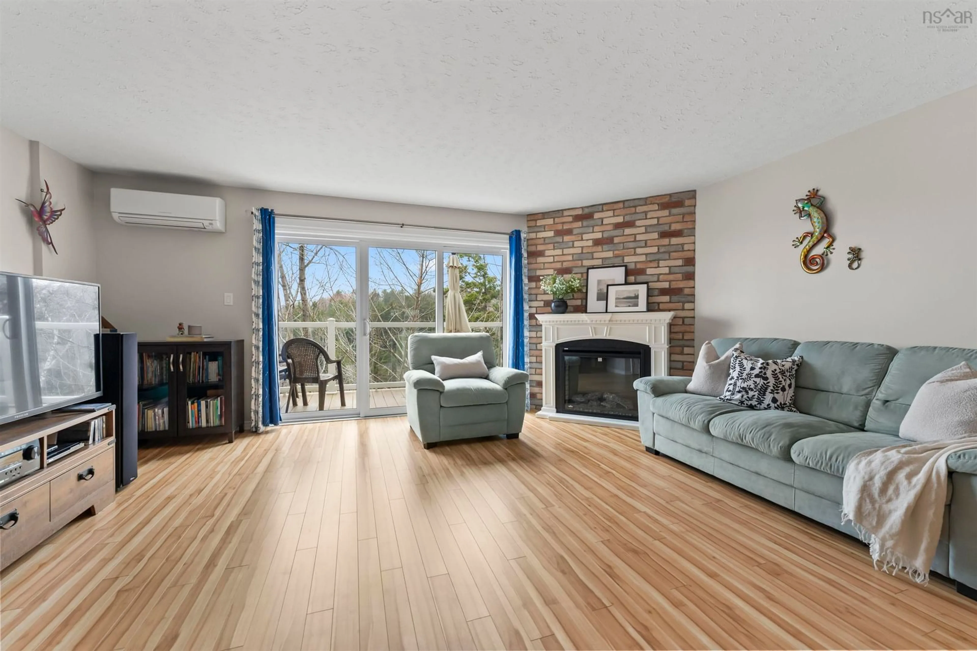 Living room with furniture, wood/laminate floor for 130 Rutledge St, Bedford Nova Scotia B4A 1X6