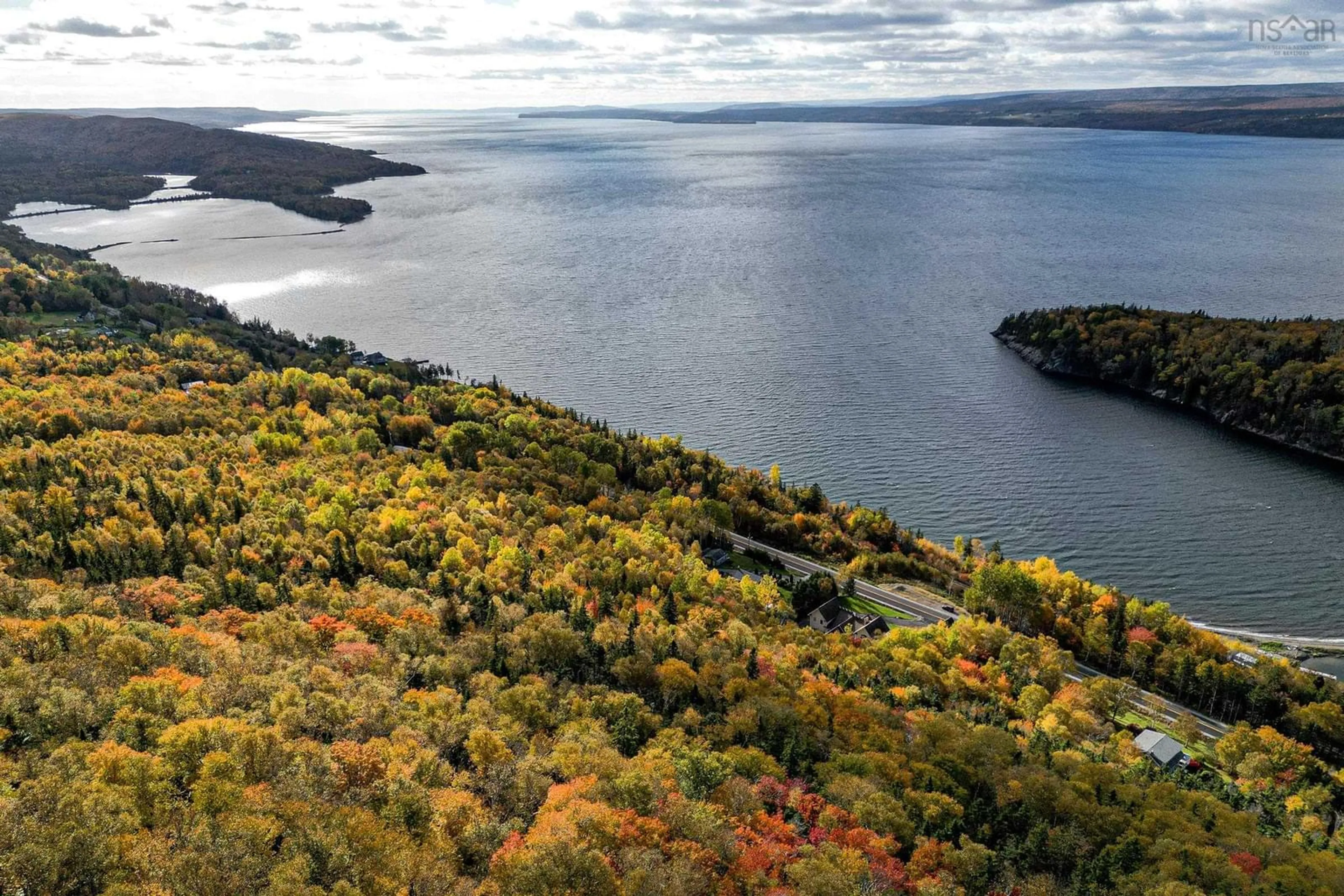 A pic from outside/outdoor area/front of a property/back of a property/a pic from drone, water/lake/river/ocean view for 3341 Long Island Rd, Barrachois Nova Scotia B1Y 3N1