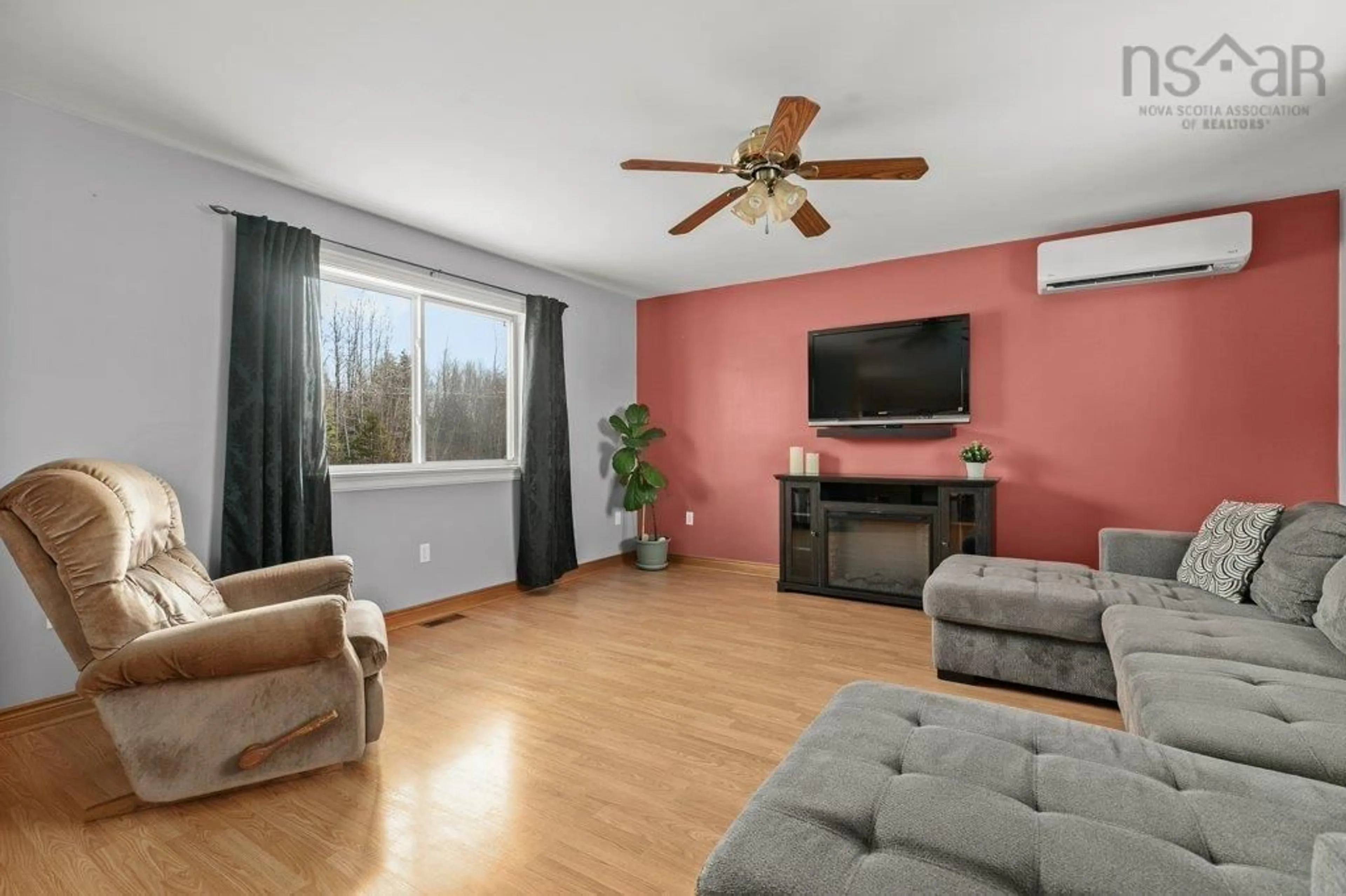 Living room with furniture, wood/laminate floor for 212 Logan Rd, Dutch Settlement Nova Scotia B2S 2E7