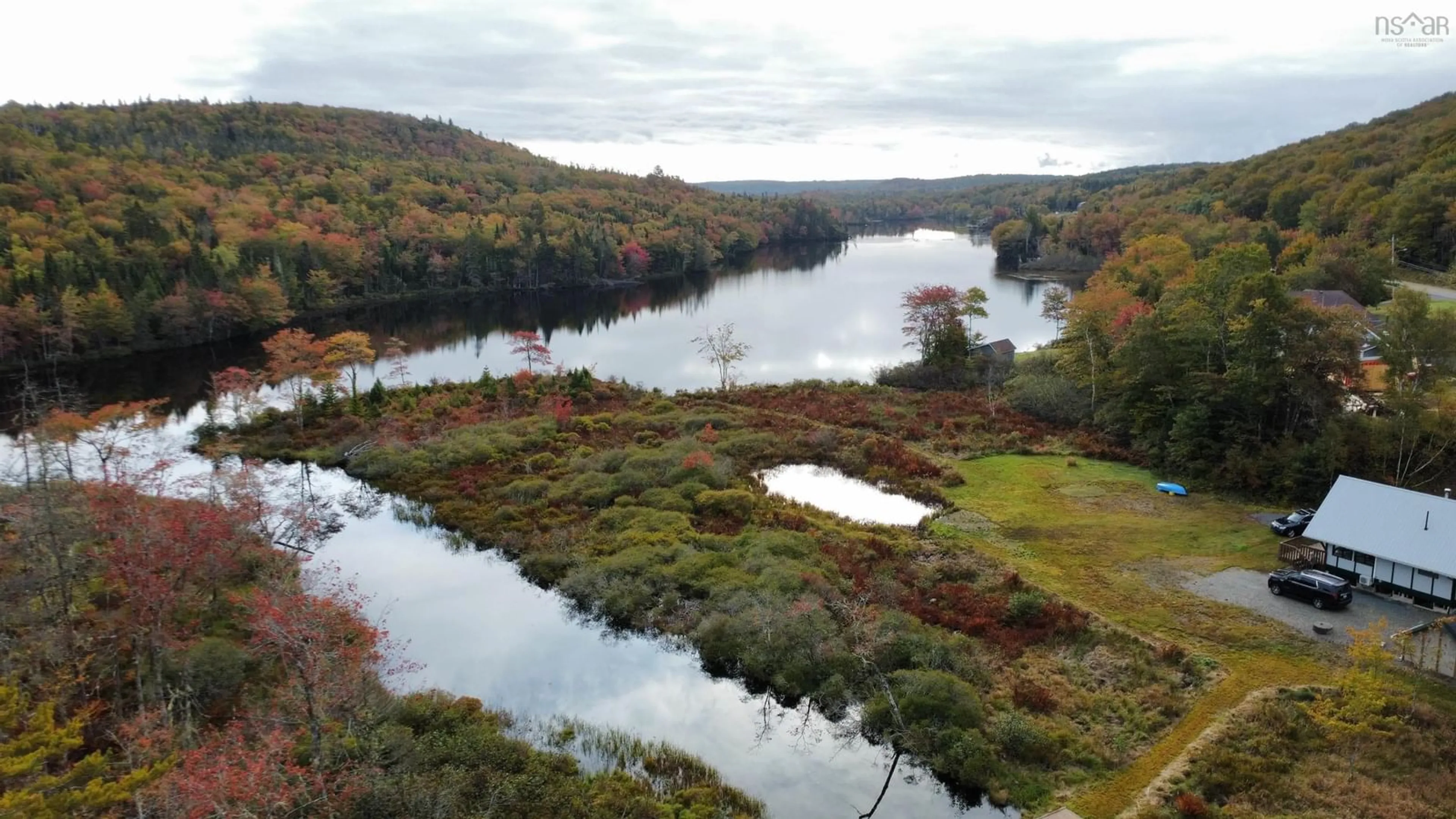 A pic from outside/outdoor area/front of a property/back of a property/a pic from drone, water/lake/river/ocean view for 1007 Highway 211, Jordanville Nova Scotia B0J 3C0