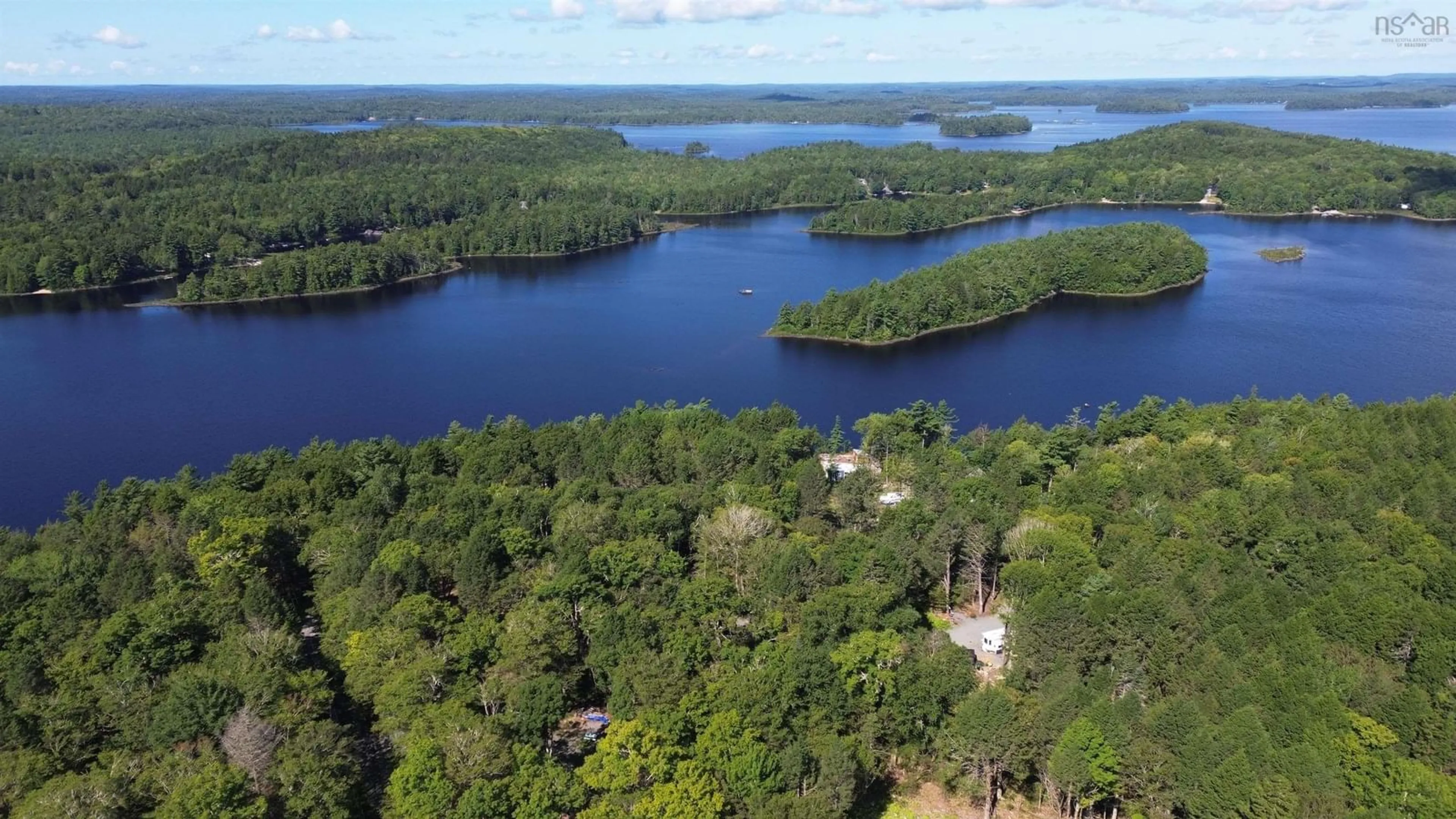 A pic from outside/outdoor area/front of a property/back of a property/a pic from drone, water/lake/river/ocean view for 145 Sunset Linkway, Labelle Nova Scotia B0T 1E0