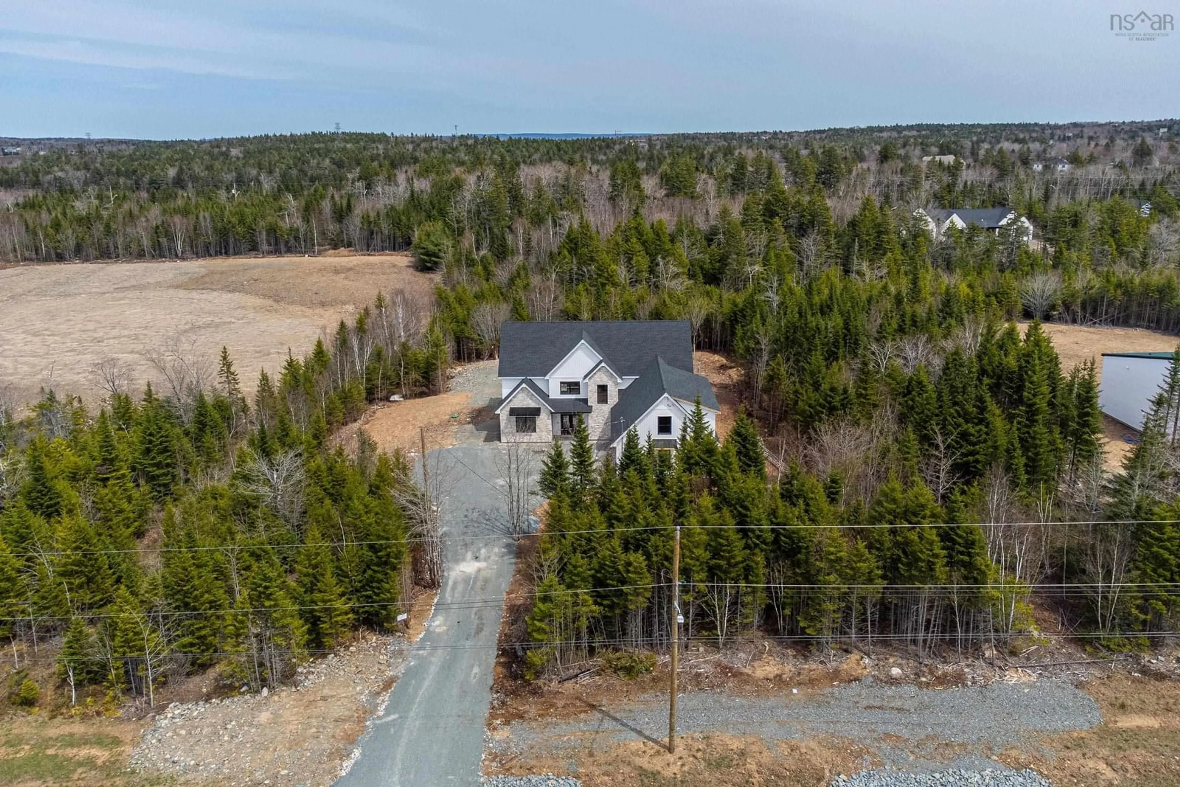 A pic from outside/outdoor area/front of a property/back of a property/a pic from drone, forest/trees view for 372 Canoe Cres, Hammonds Plains Nova Scotia B4B 2P5