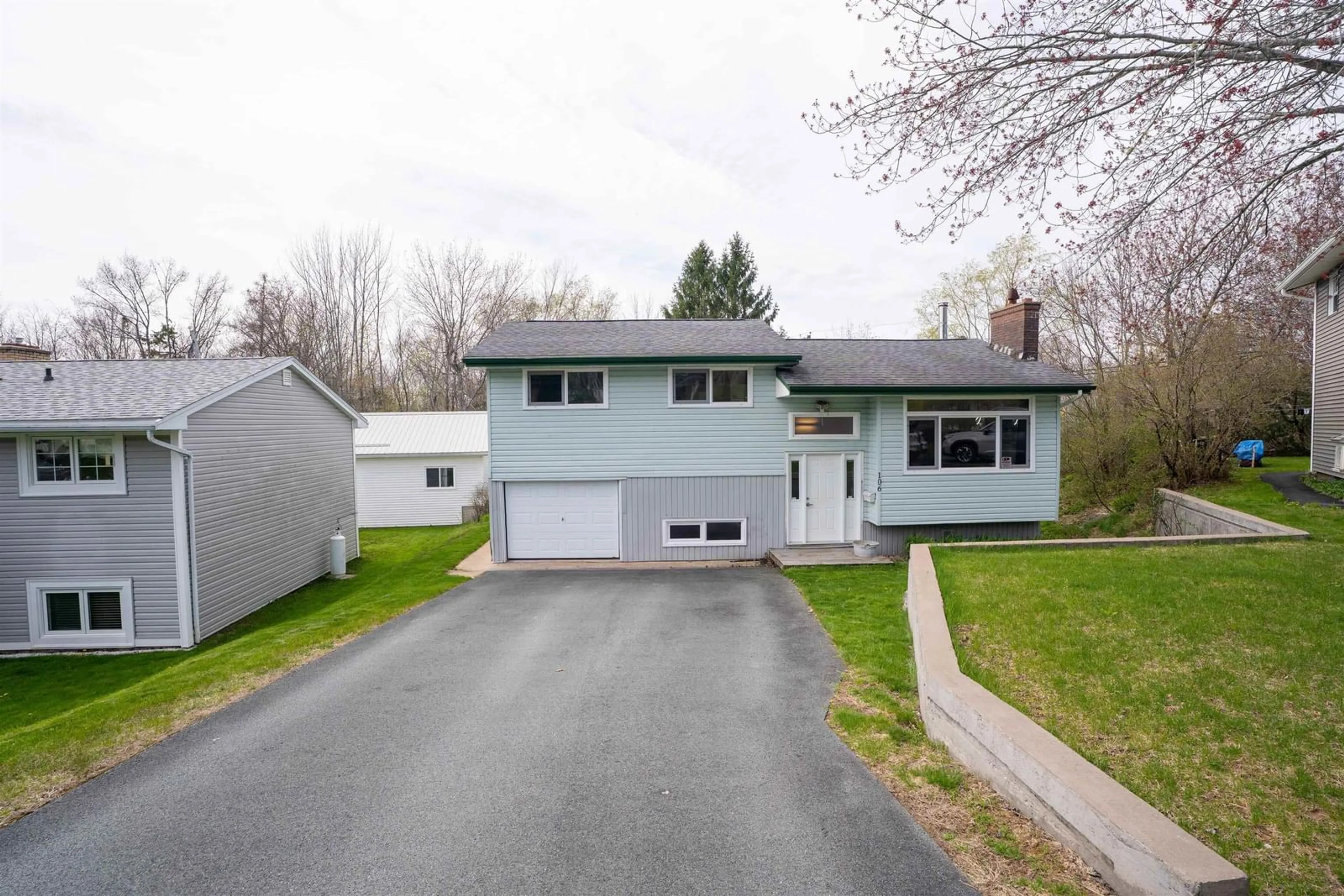 Home with vinyl exterior material, street for 106 Belleshire Dr, Lower Sackville Nova Scotia B4C 1M7