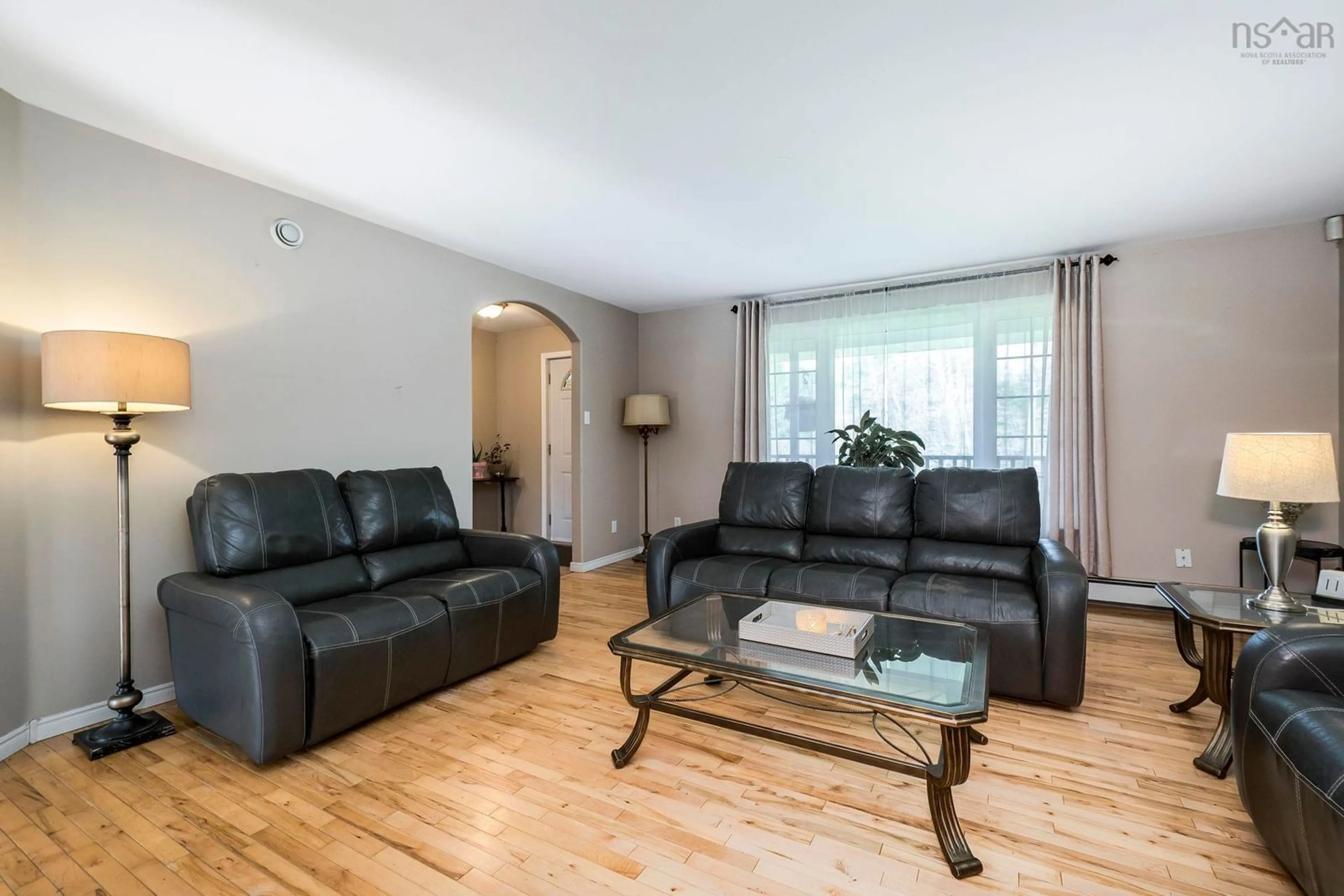 Living room with furniture, wood/laminate floor for 18 Merganser Ave, Timberlea Nova Scotia B3T 1J1