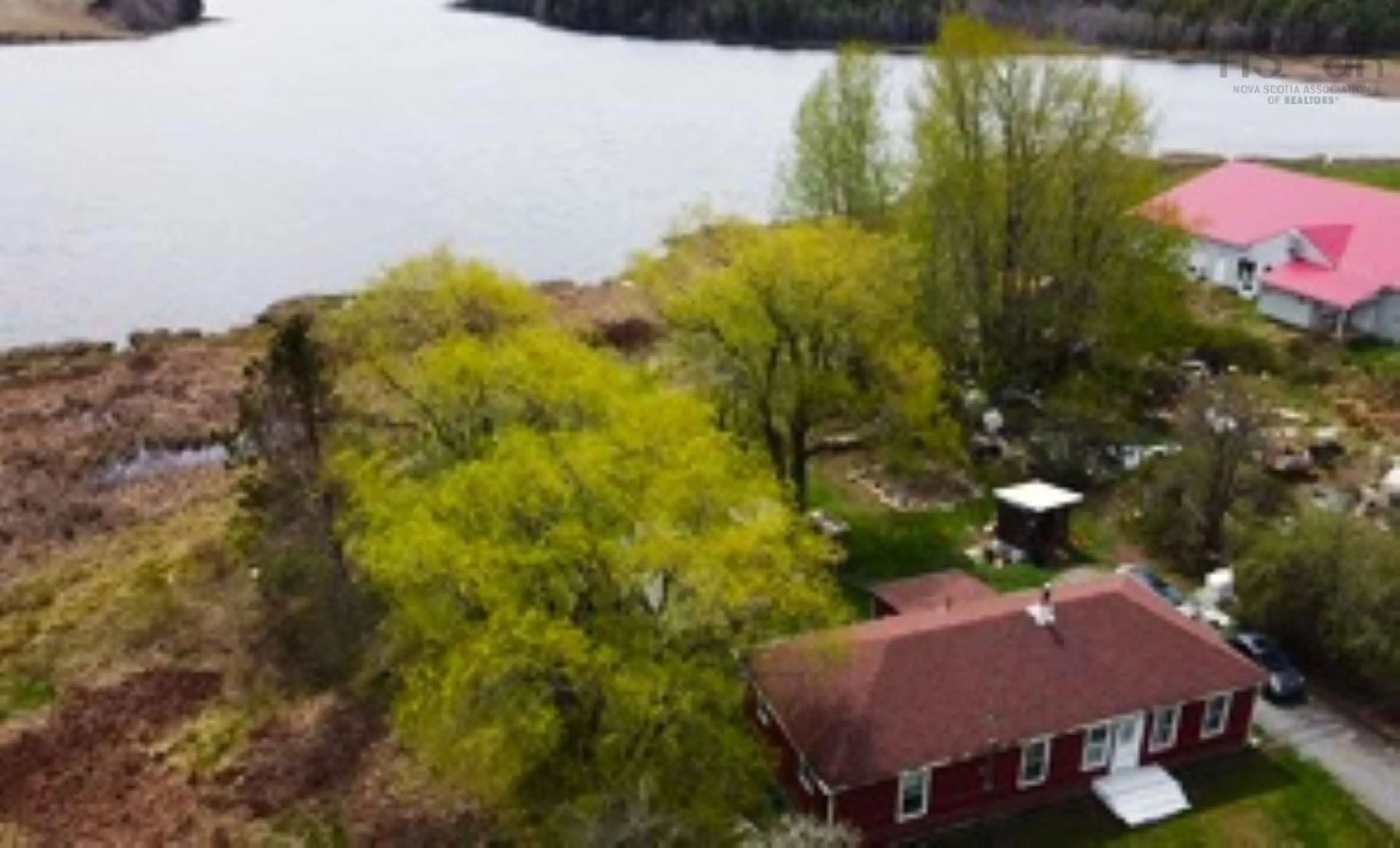 A pic from outside/outdoor area/front of a property/back of a property/a pic from drone, water/lake/river/ocean view for 9773 Highway 8, Caledonia Nova Scotia B0T 1B0