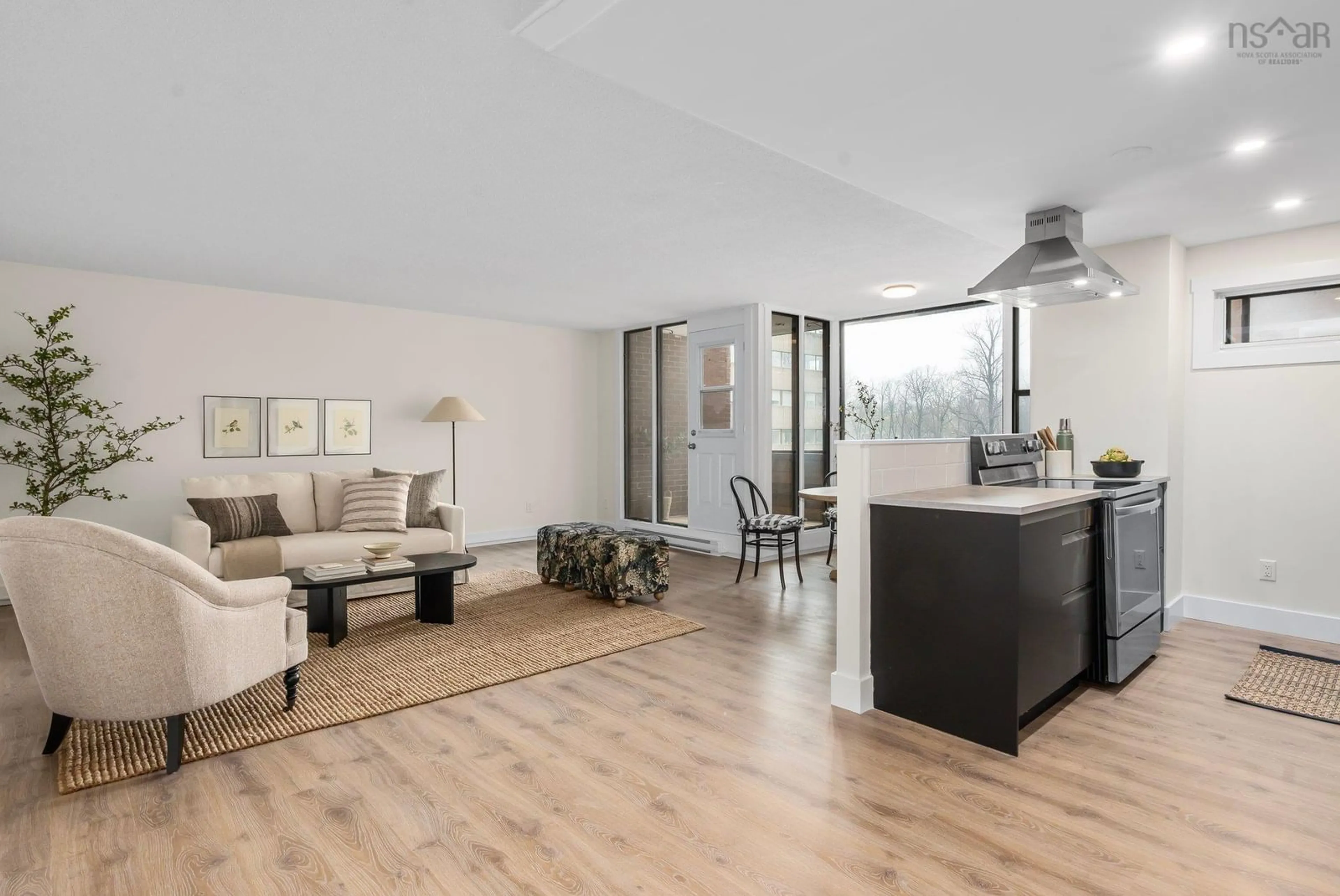 Living room with furniture, wood/laminate floor for 5959 Spring Garden Rd #401, Halifax Nova Scotia B3H 1Y4