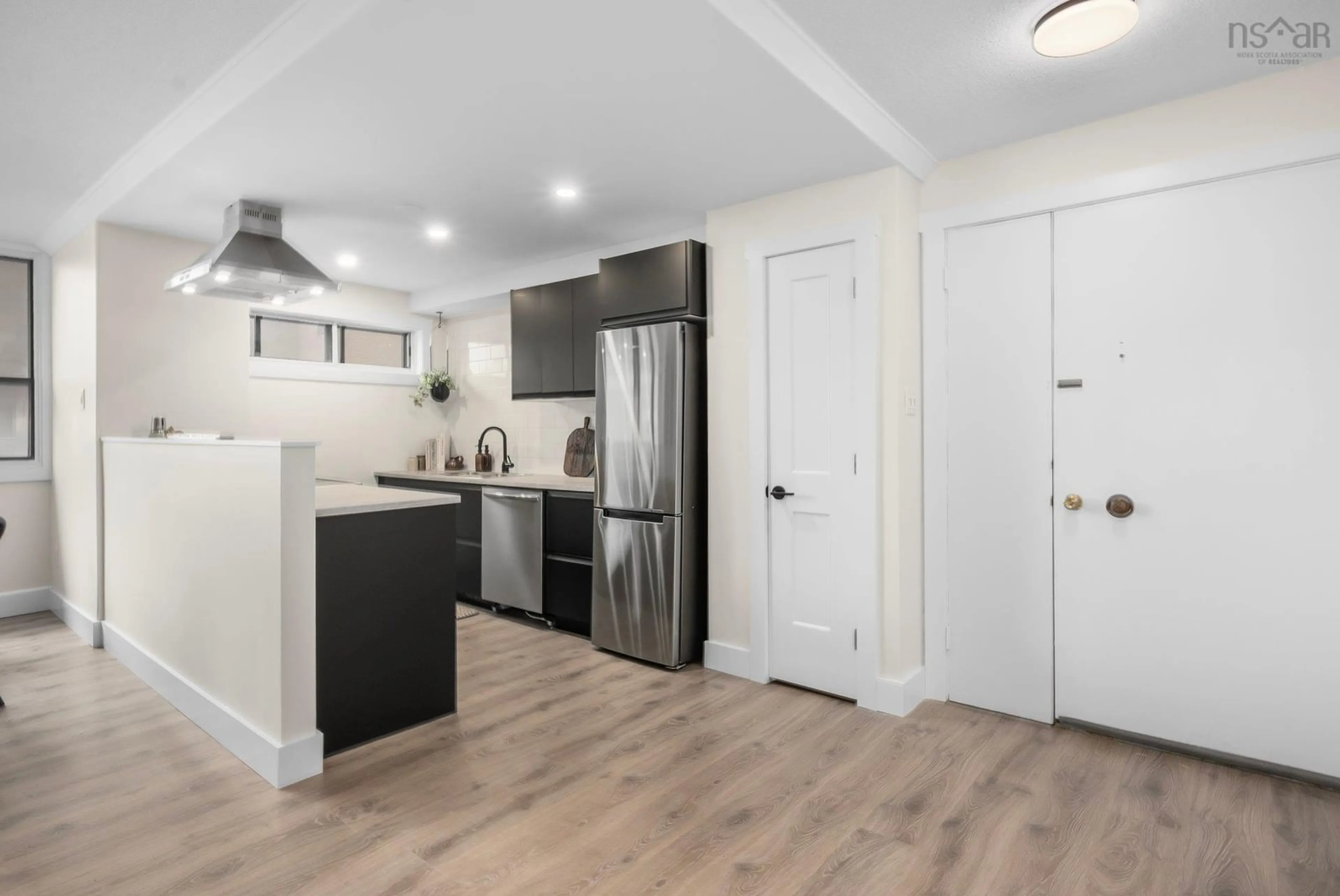Open concept kitchen, wood/laminate floor for 5959 Spring Garden Rd #401, Halifax Nova Scotia B3H 1Y4