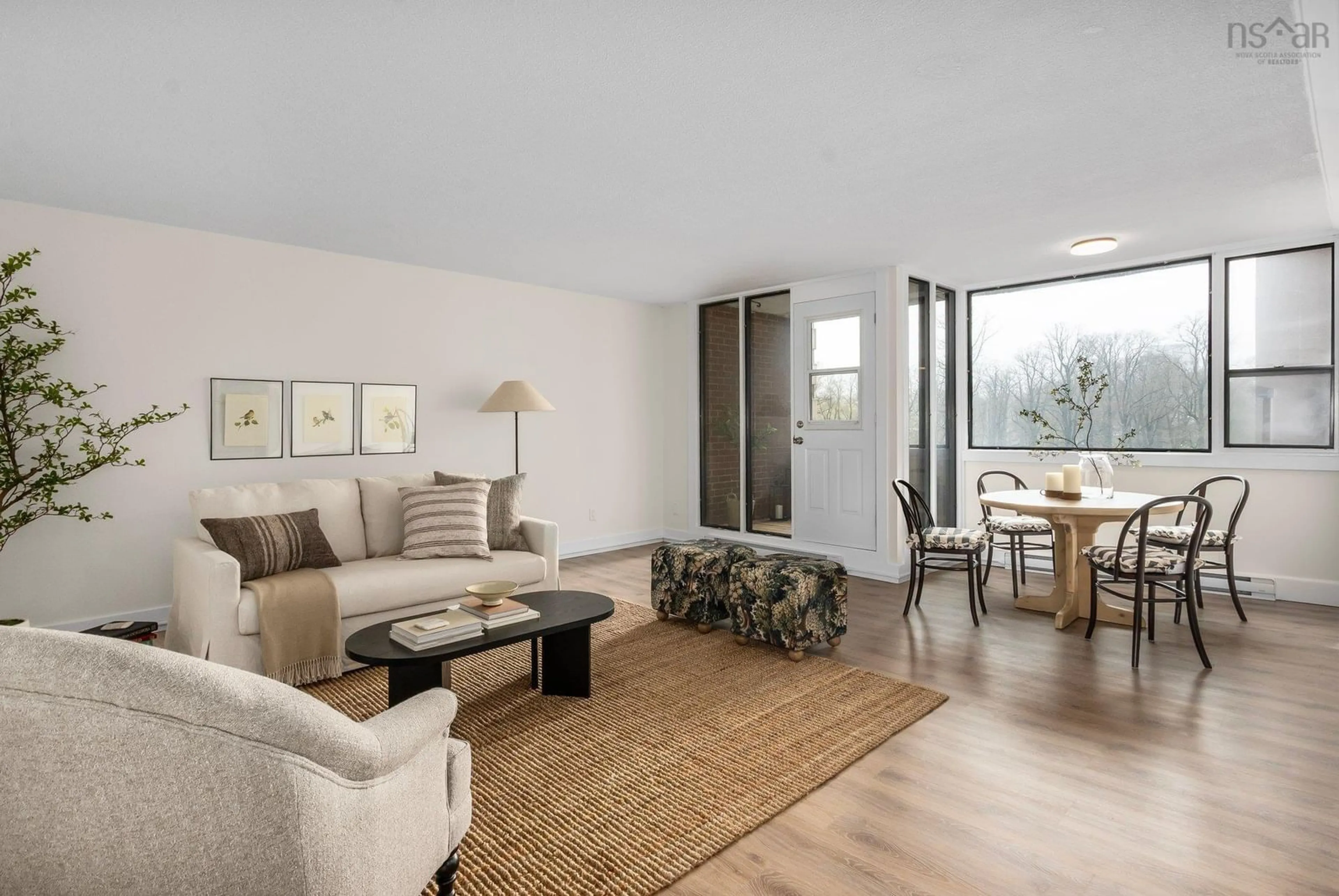 Living room with furniture, wood/laminate floor for 5959 Spring Garden Rd #401, Halifax Nova Scotia B3H 1Y4