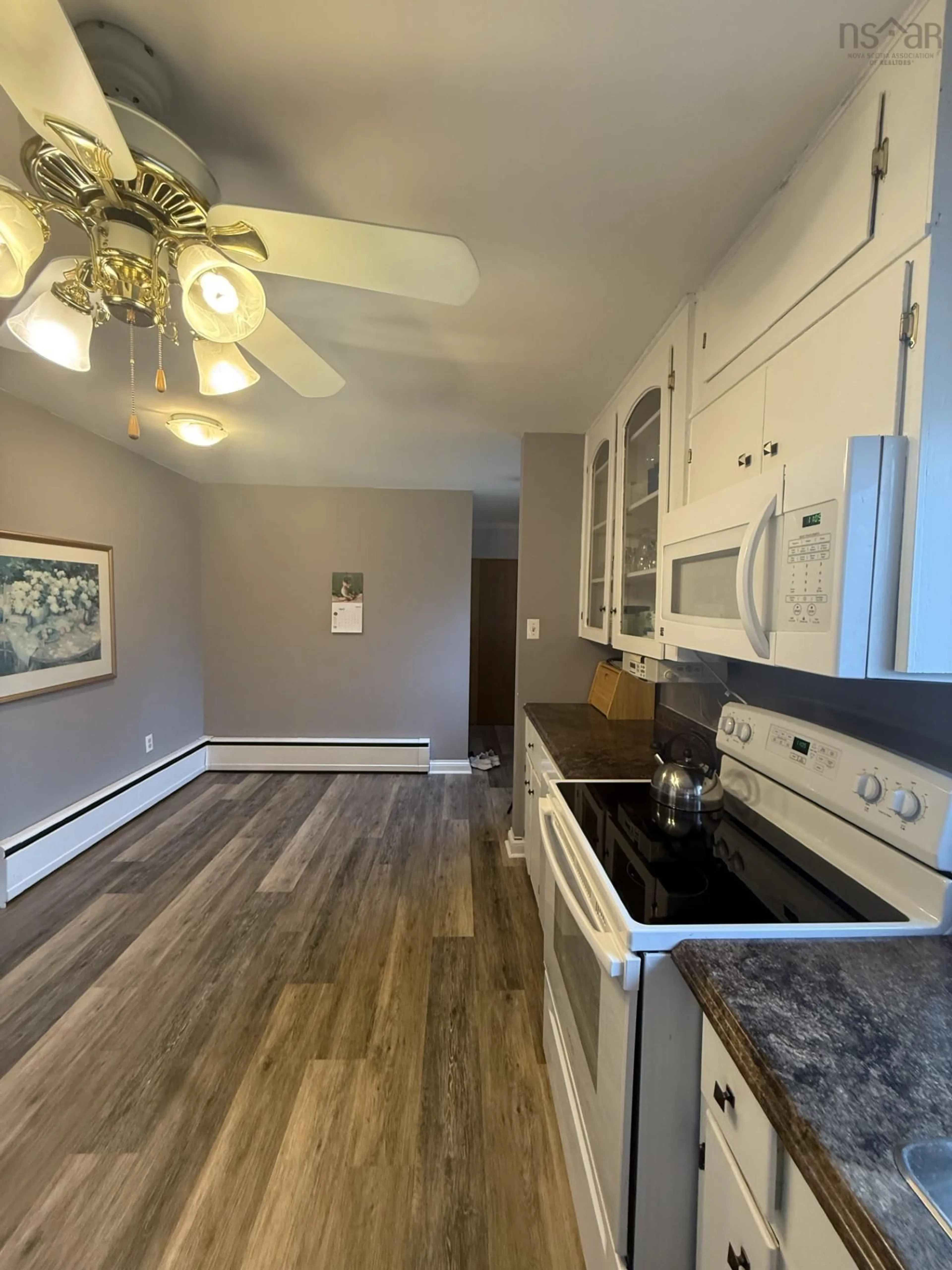 Open concept kitchen, wood/laminate floor for 34 Arbor Dr, Antigonish Nova Scotia B2G 1S7