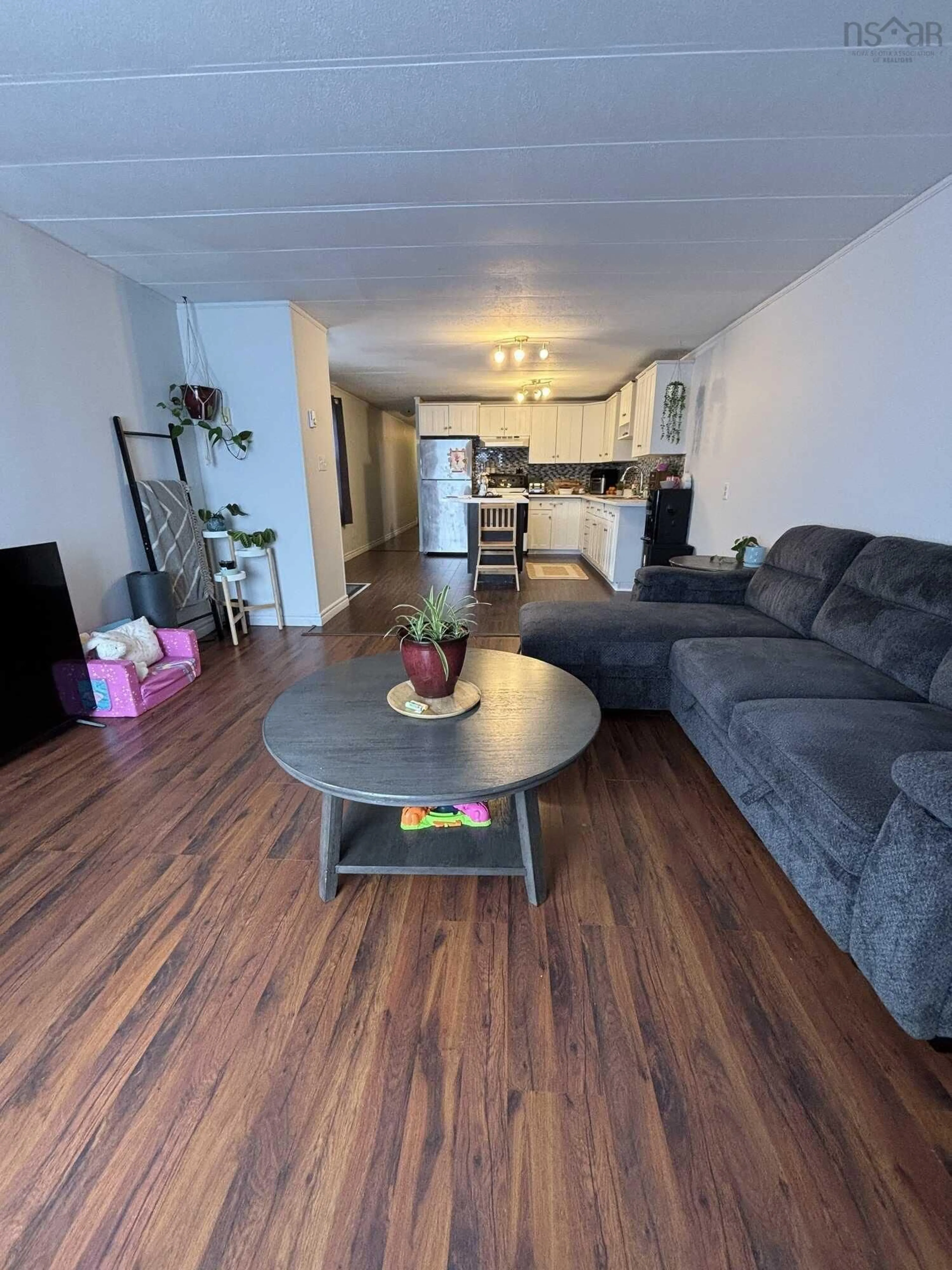 Living room with furniture, wood/laminate floor for 39 Spring Cres, Bridgewater Nova Scotia B4V 3G3
