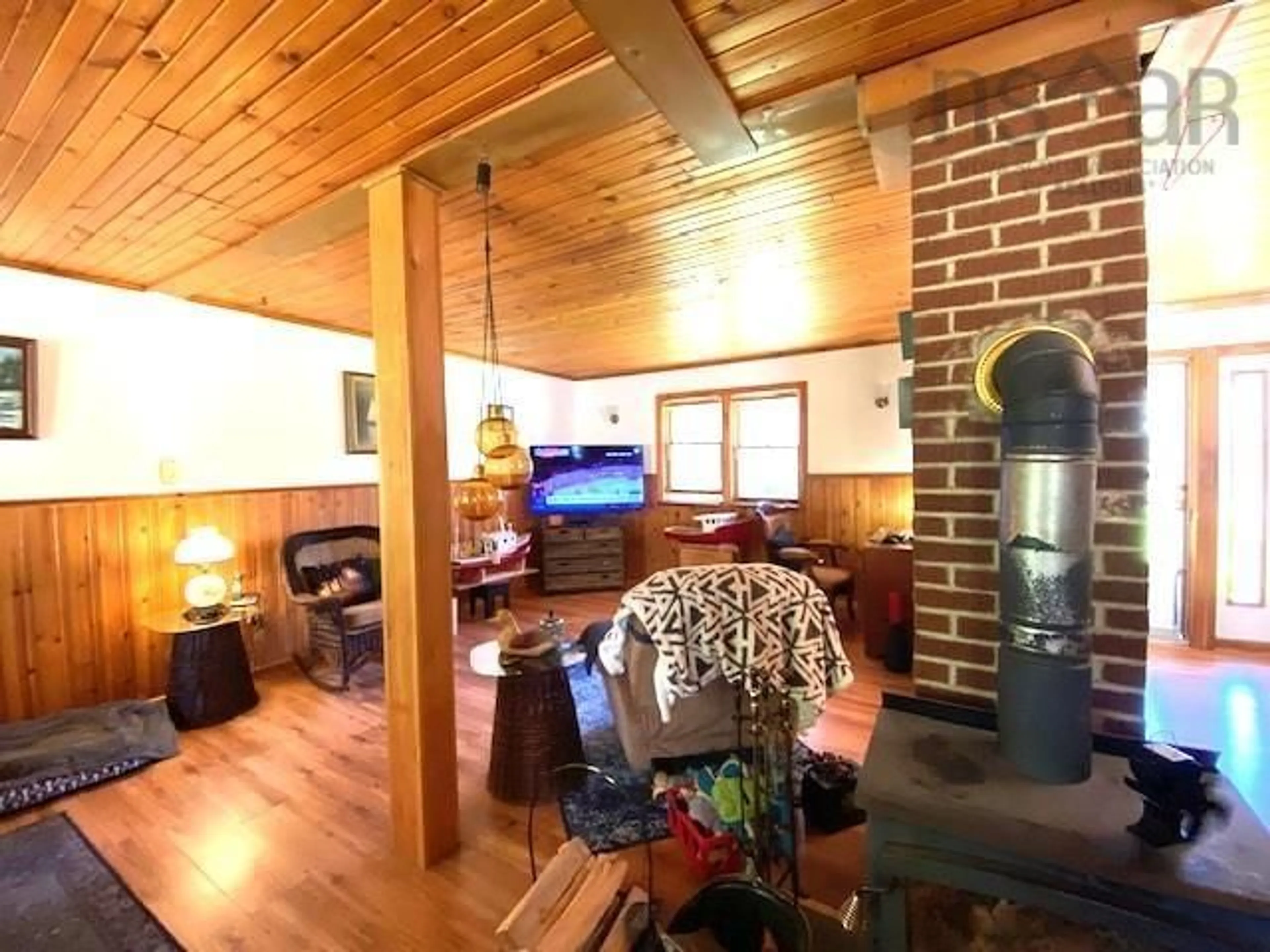 Living room with furniture, wood/laminate floor for 1452 Lake Rd, Sandy Point Nova Scotia B0T 1W0