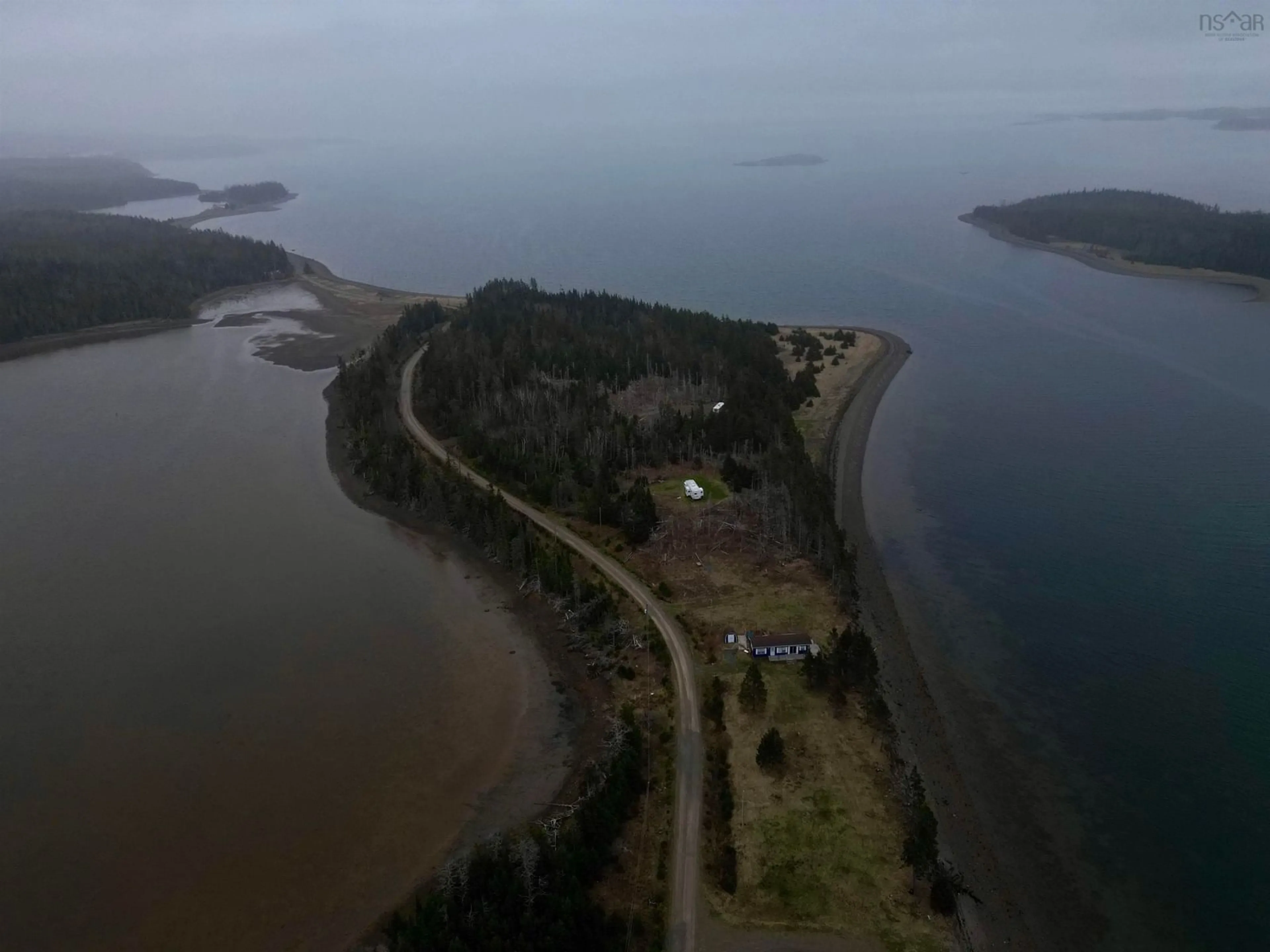 A pic from outside/outdoor area/front of a property/back of a property/a pic from drone, water/lake/river/ocean view for 85 Mariner Dr, River Bourgeois Nova Scotia B0E 2X0