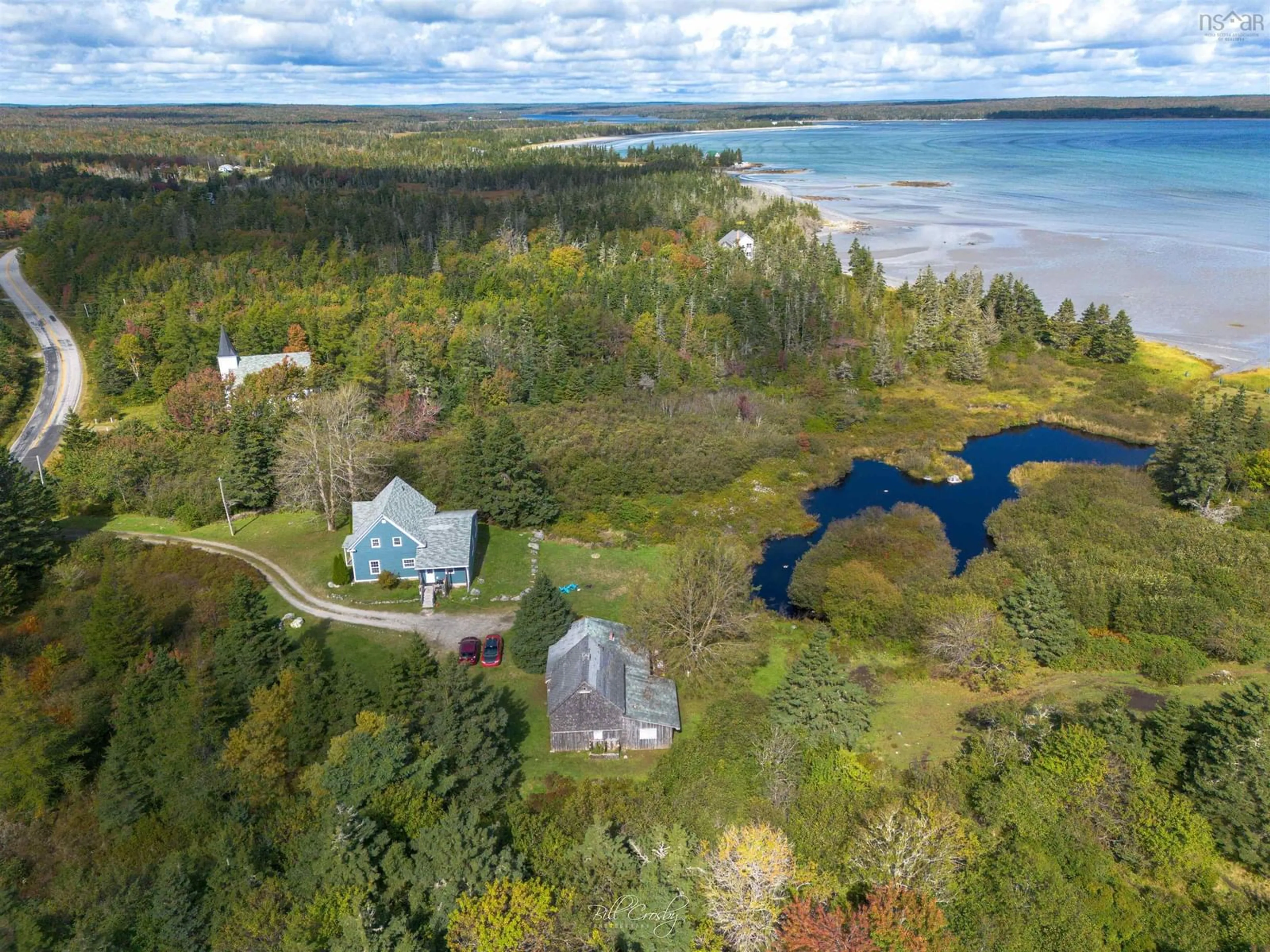 A pic from outside/outdoor area/front of a property/back of a property/a pic from drone, water/lake/river/ocean view for 1815 West Sable Rd, Sable River Nova Scotia B0T 1V0