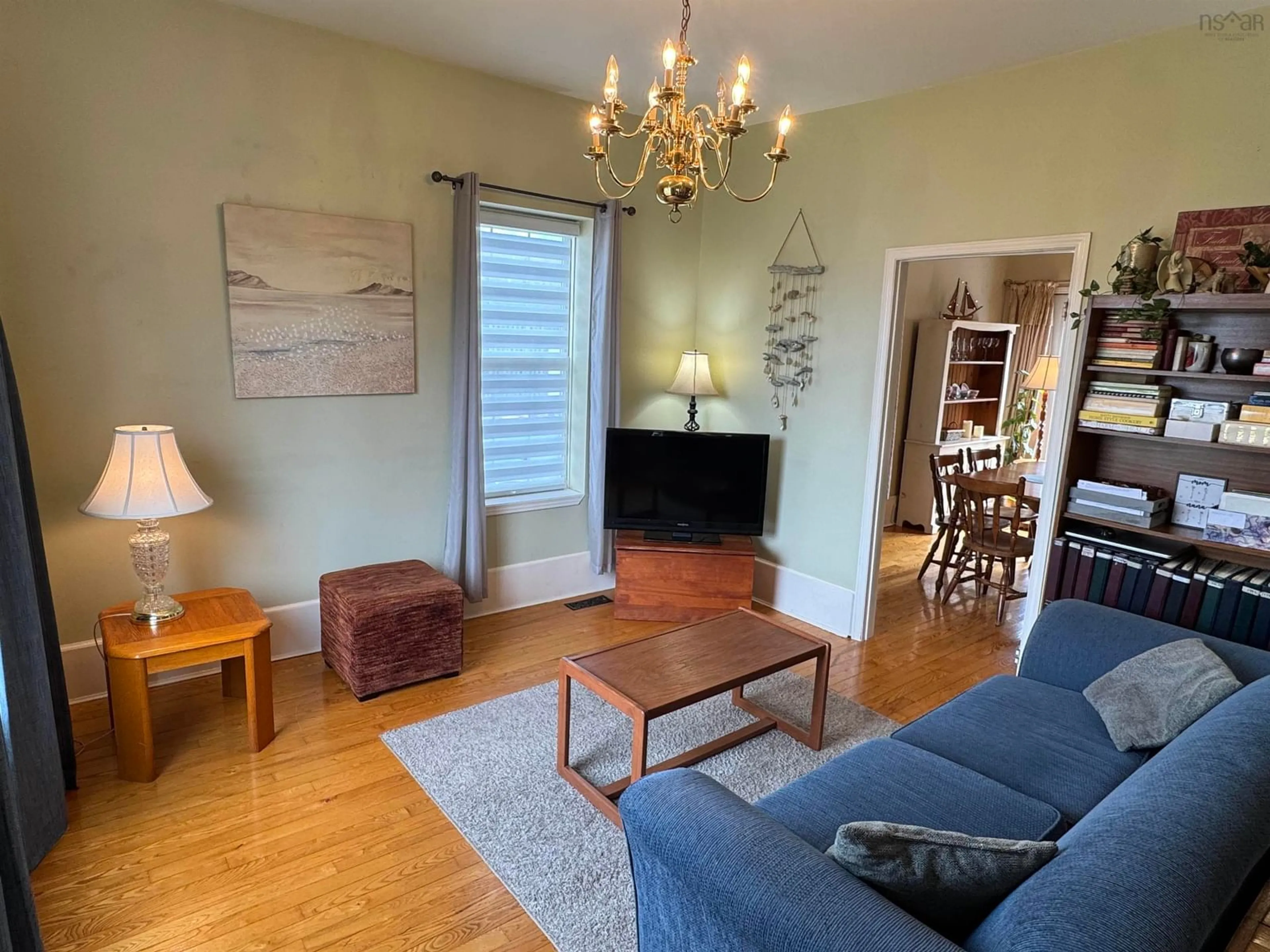 Living room with furniture, wood/laminate floor for 1793 Victoria St, Westville Nova Scotia B0K 2A0