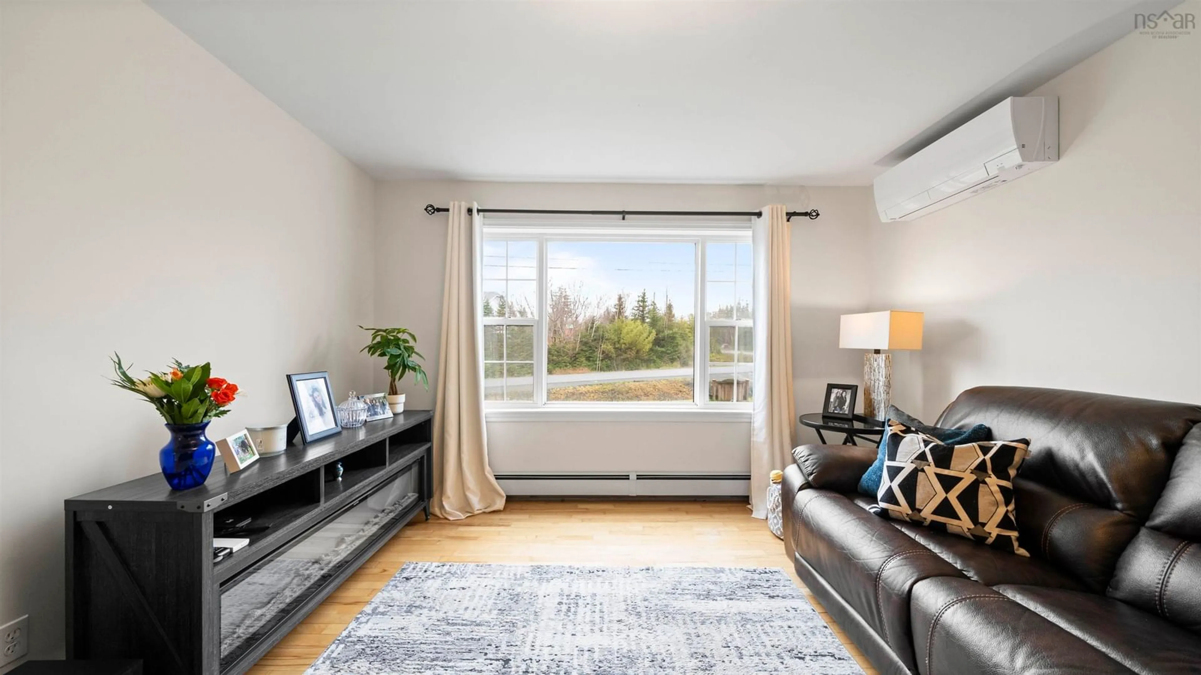 Living room with furniture, wood/laminate floor for 2 Kensington Crt, Lawrencetown Nova Scotia B2Z 1T3