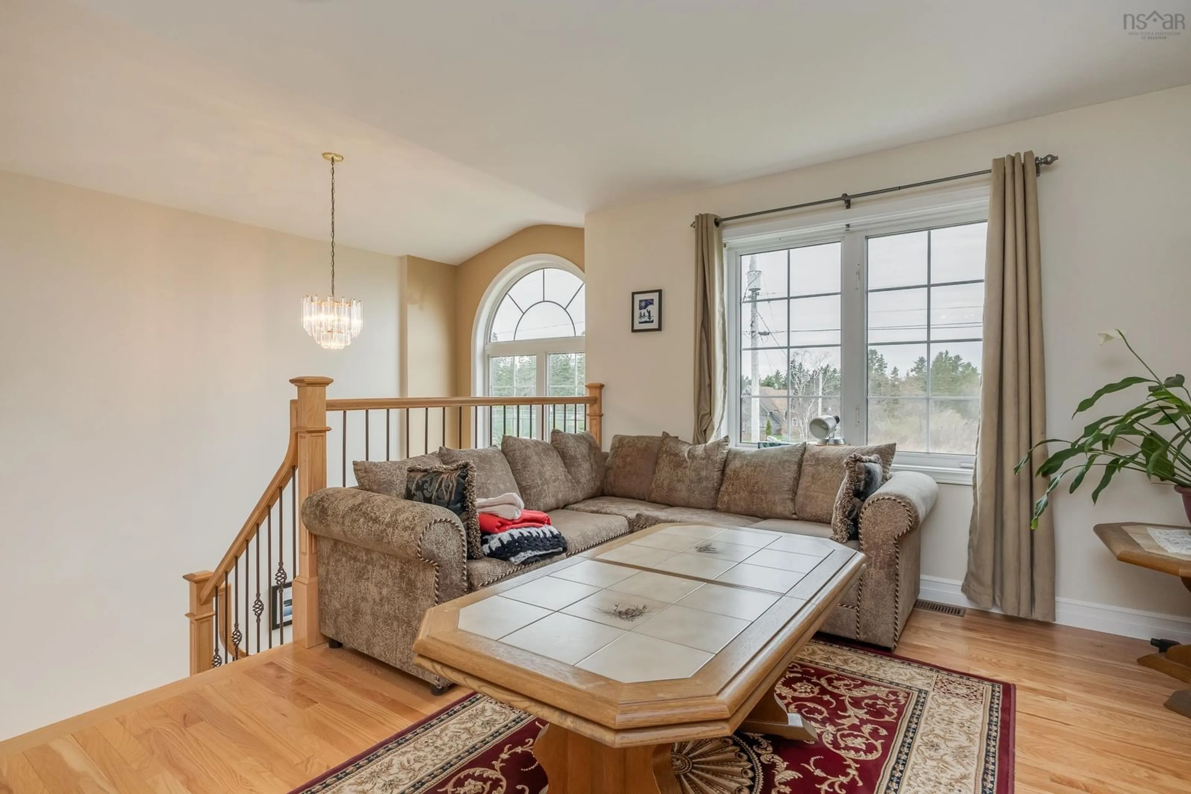 Living room with furniture, wood/laminate floor for 58 Dimock Road, Margaretsville Nova Scotia B0S 1N0