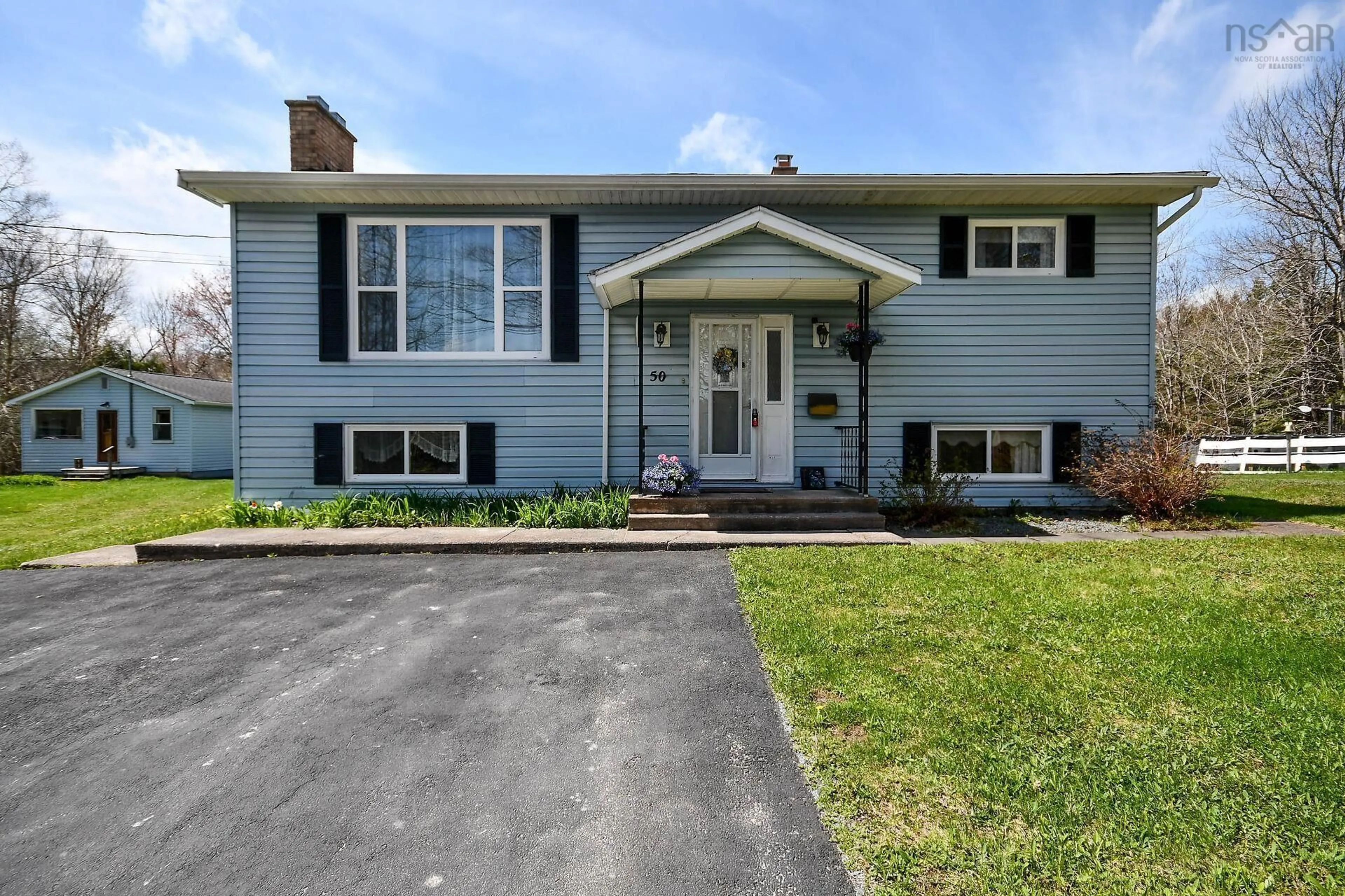Home with vinyl exterior material, street for 50 Station Rd, Kinsac Nova Scotia B4G 1C8