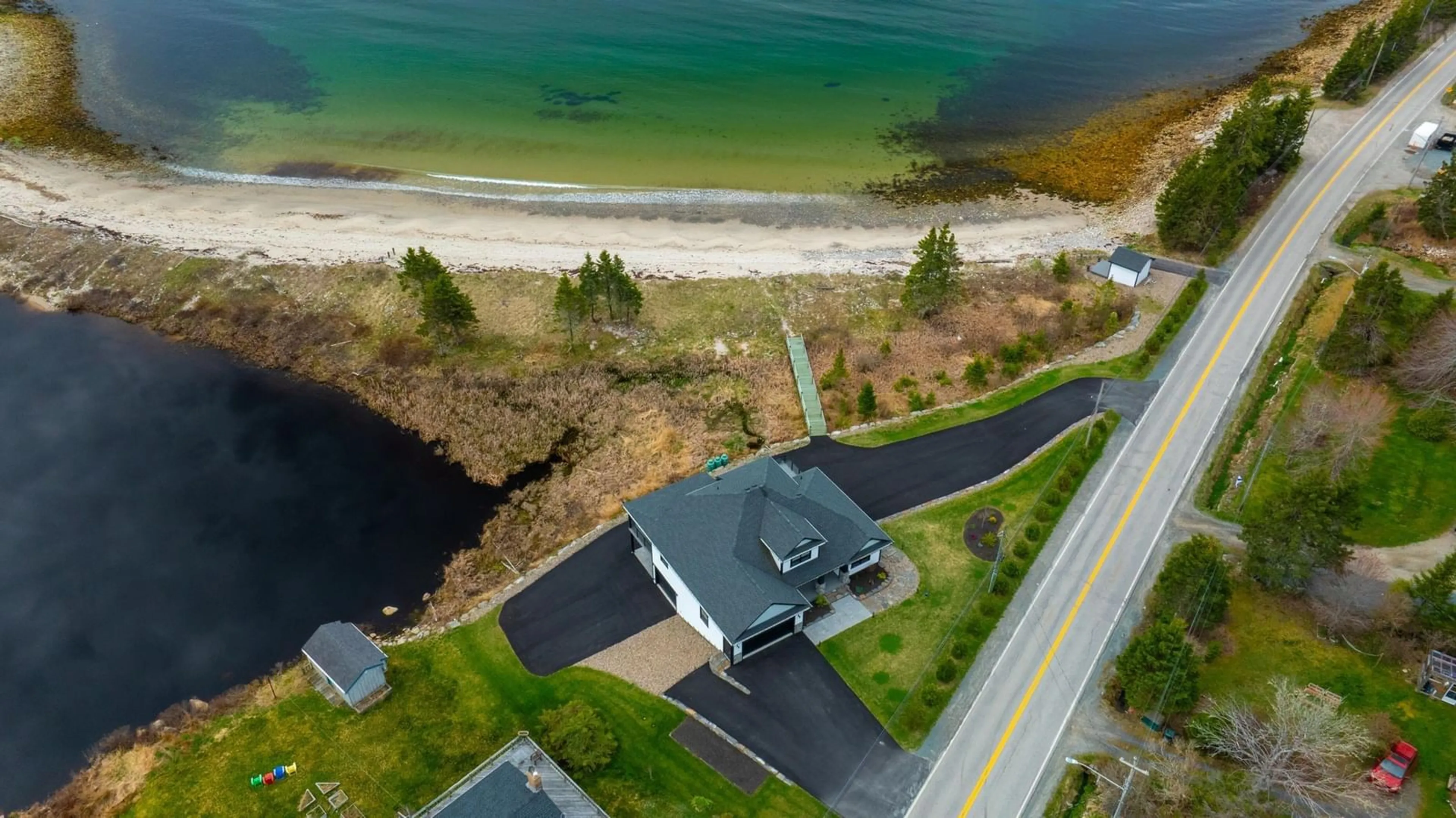 A pic from outside/outdoor area/front of a property/back of a property/a pic from drone, water/lake/river/ocean view for 8286 St. Margarets Bay Rd, Black Point Nova Scotia B0J 1B0