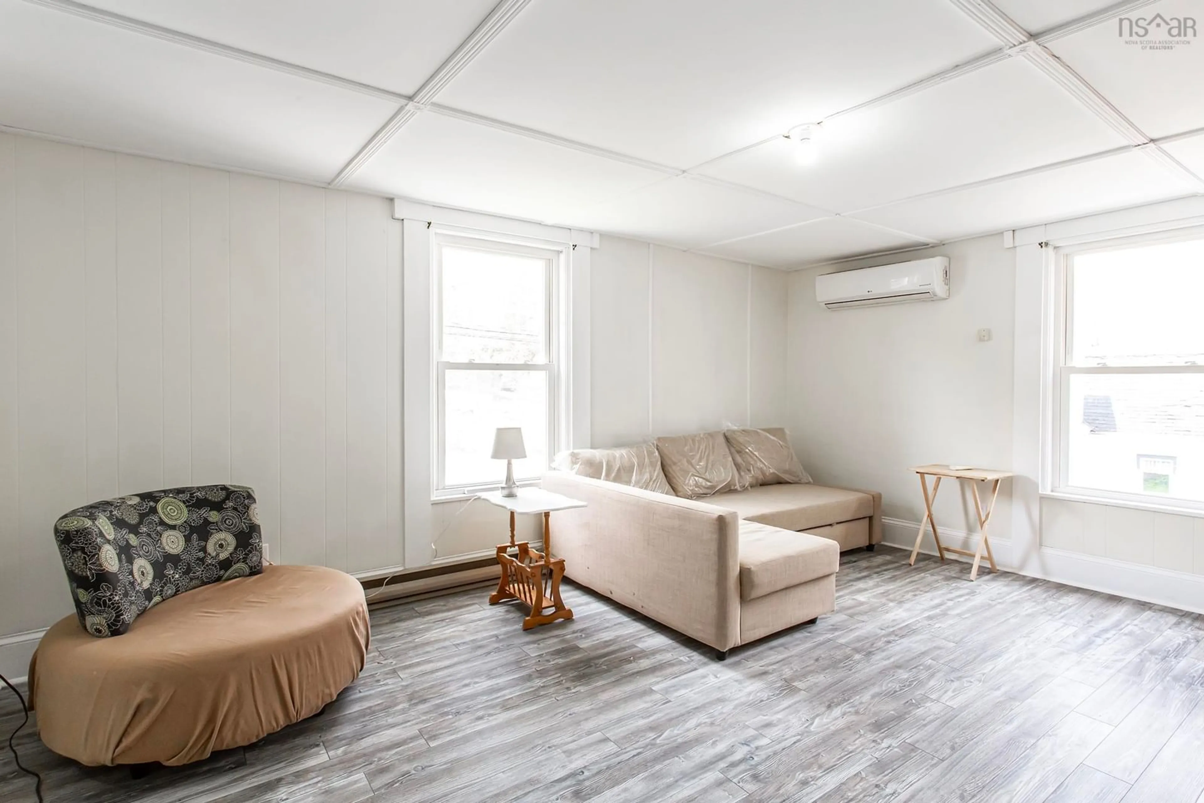 Living room with furniture, wood/laminate floor for 1361 River Rd, Bear River Nova Scotia B0S 1B0