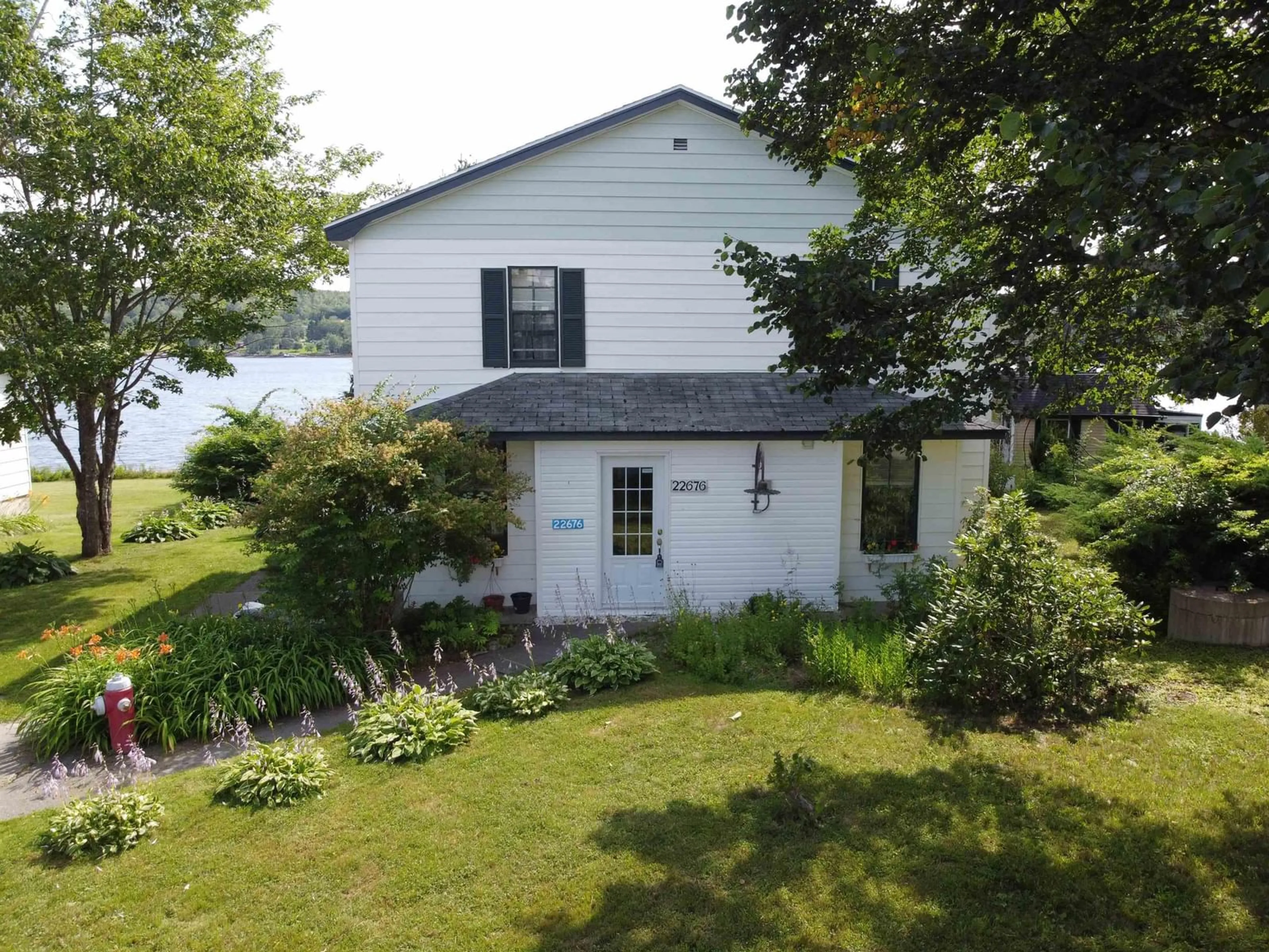 A pic from outside/outdoor area/front of a property/back of a property/a pic from drone, water/lake/river/ocean view for 22676 Highway 7, Sheet Harbour Nova Scotia B0J 3B0
