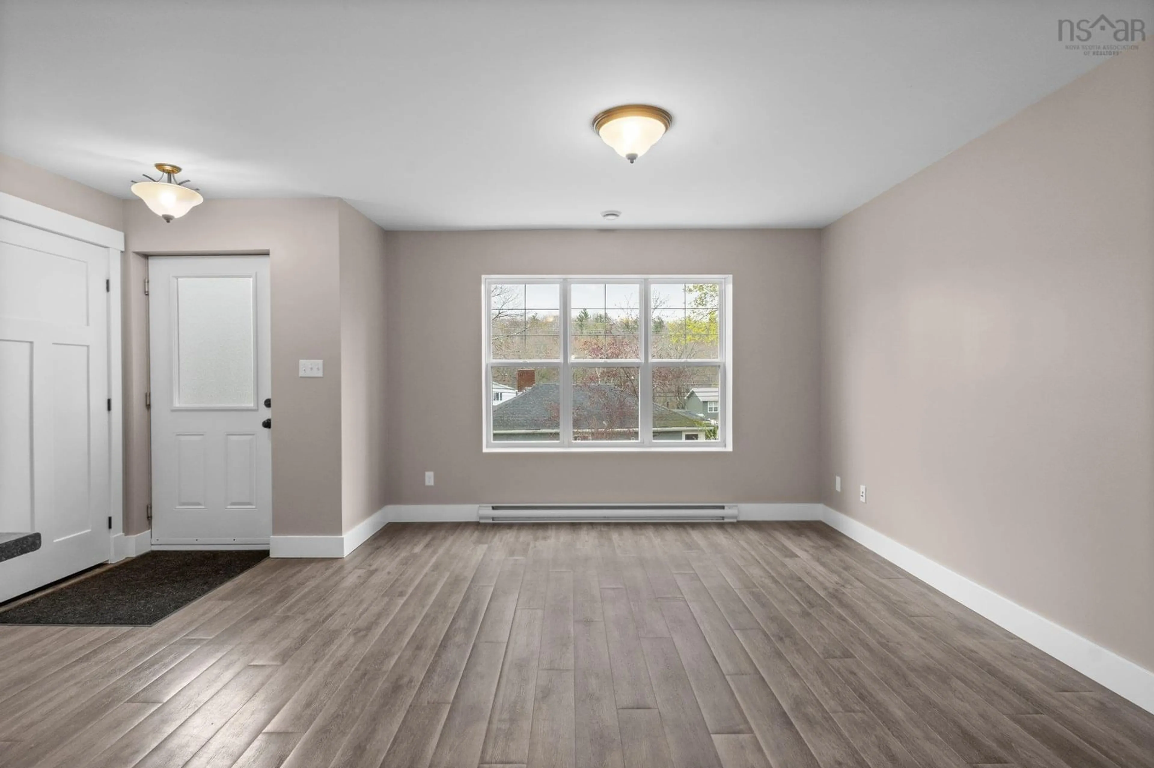 Living room with furniture, wood/laminate floor for 394 Rocky Lake Dr, Bedford Nova Scotia B4A 2T5