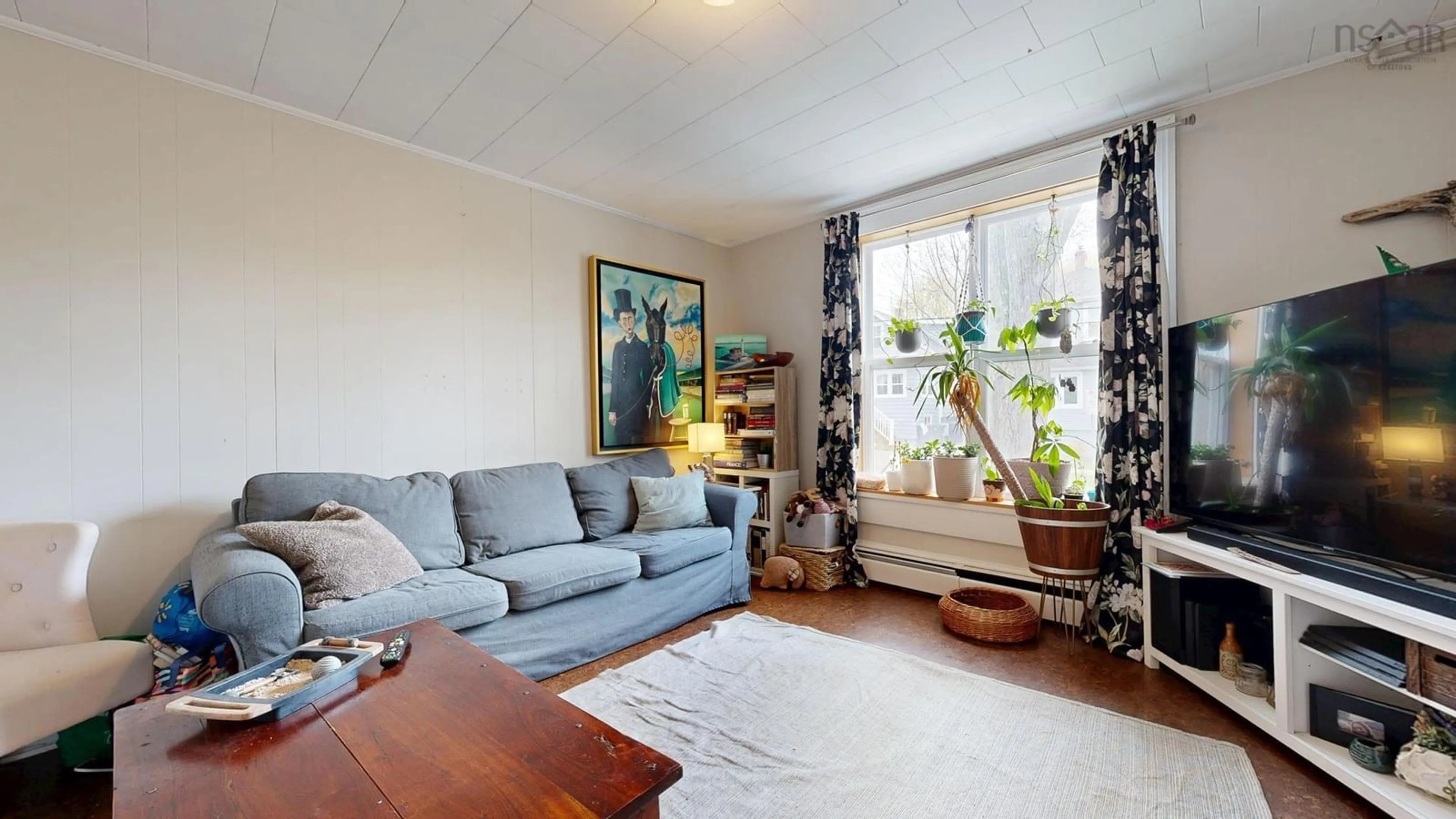 Living room with furniture, wood/laminate floor for 2026 Kline St, Halifax Nova Scotia B3L 2X3