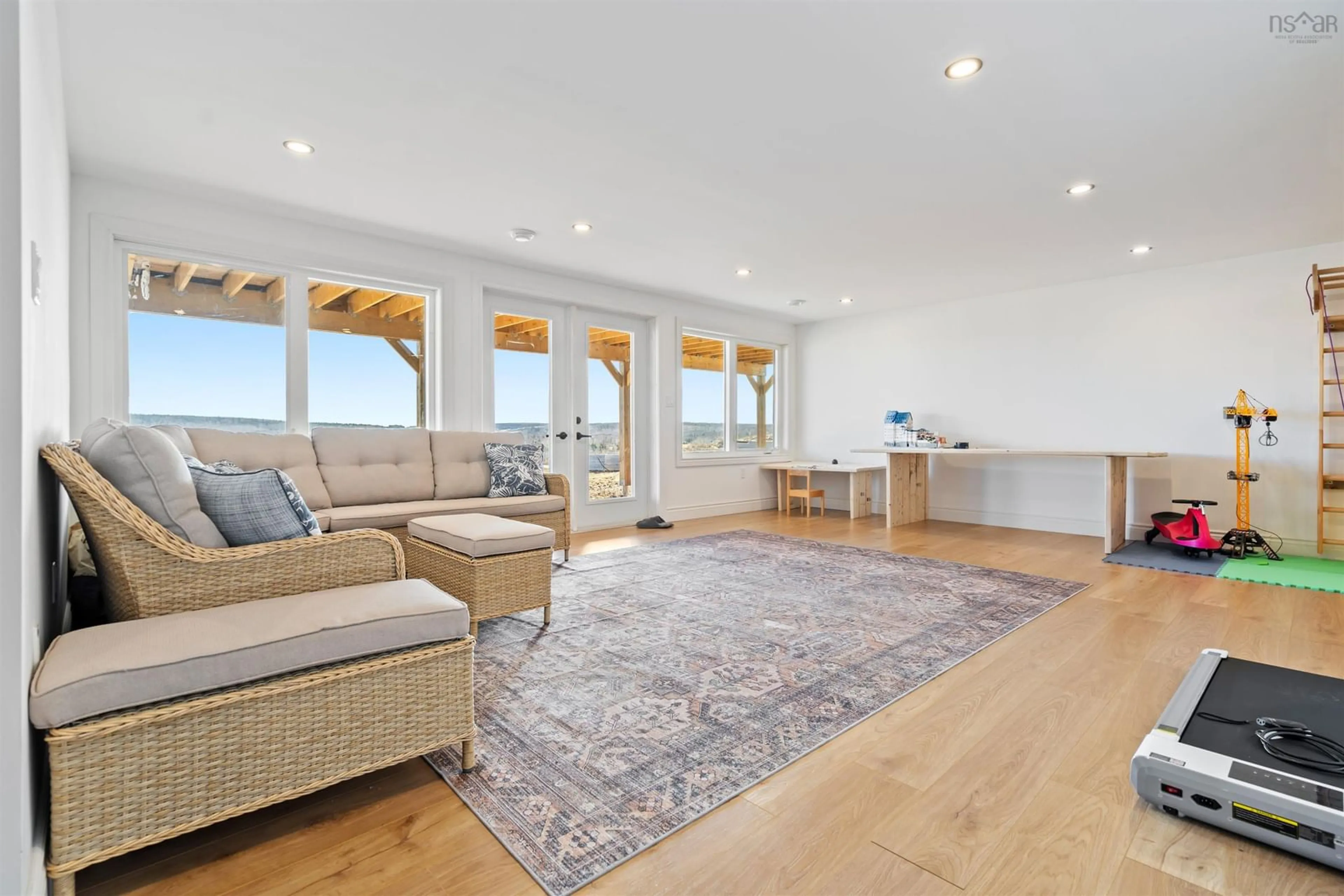 Living room with furniture, wood/laminate floor for 458 Farm Rd, Heatherton Nova Scotia B0H 1R0
