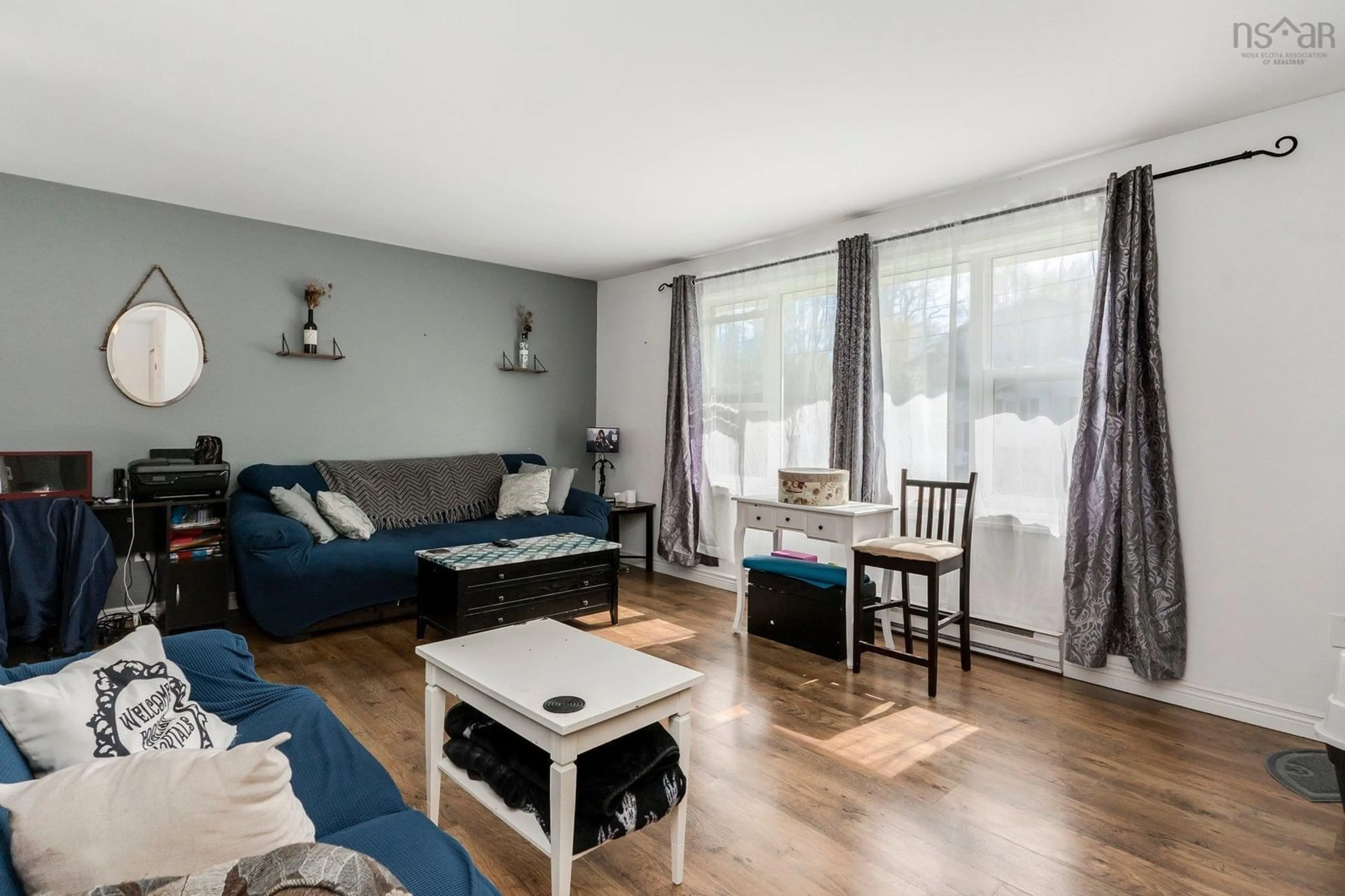 Living room with furniture, wood/laminate floor for 77 Wynn Castle Dr, Lower Sackville Nova Scotia B4E 2R6