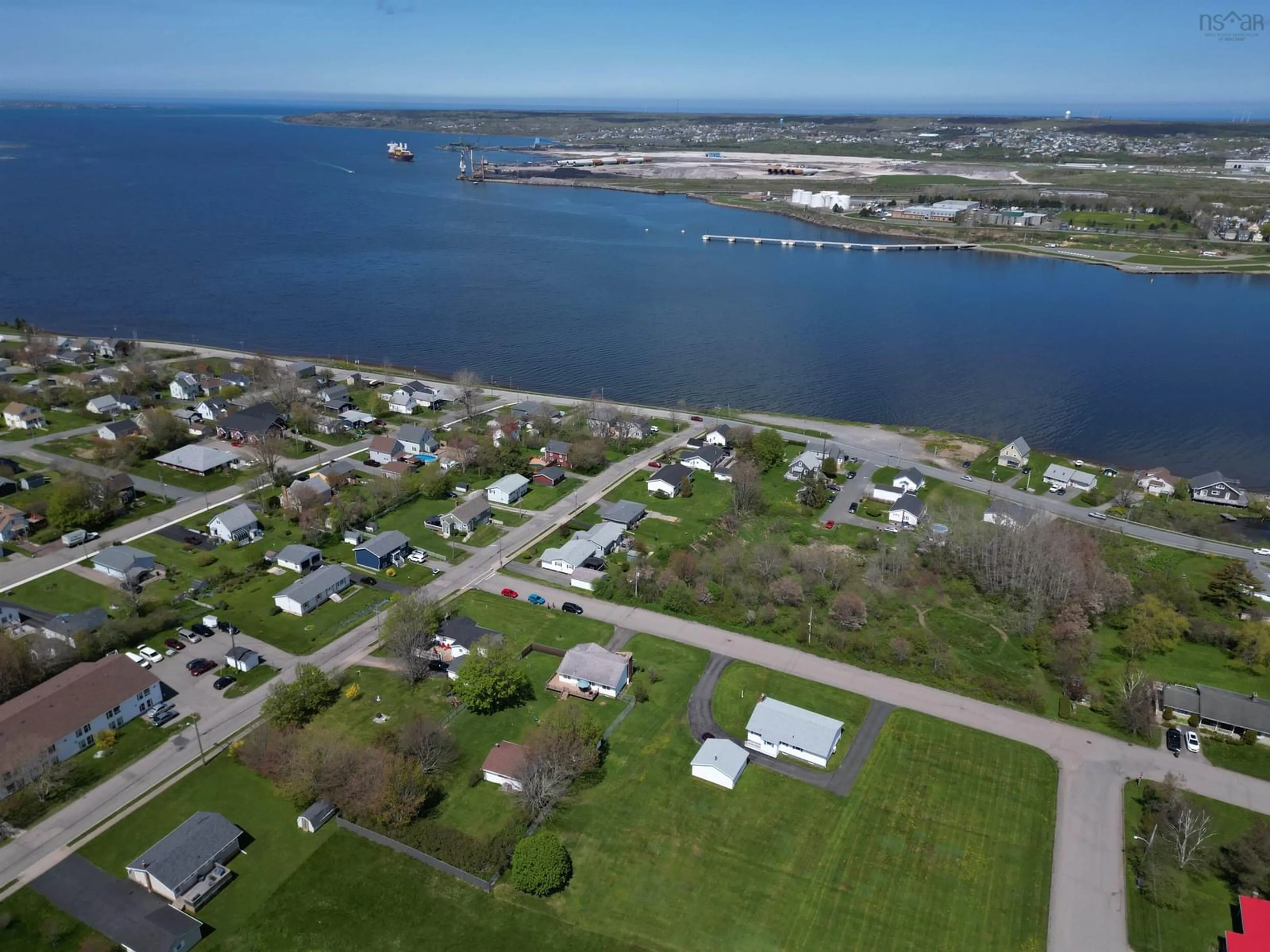 A pic from outside/outdoor area/front of a property/back of a property/a pic from drone, water/lake/river/ocean view for 47 Hebrides Dr, Westmount Nova Scotia B1R 2A3