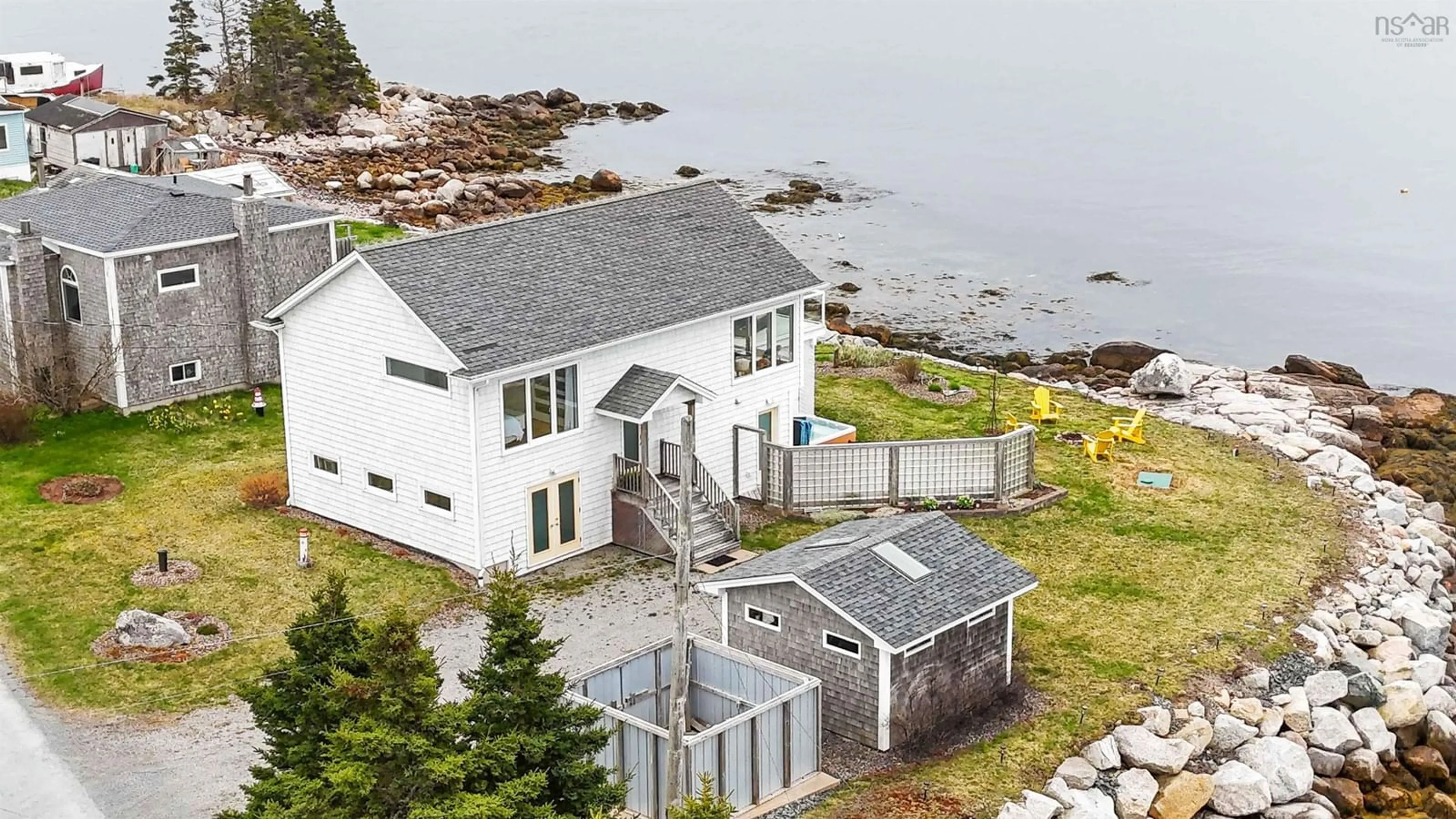 A pic from outside/outdoor area/front of a property/back of a property/a pic from drone, water/lake/river/ocean view for 39 Bull Point Rd, Sambro Nova Scotia B3V 1R3