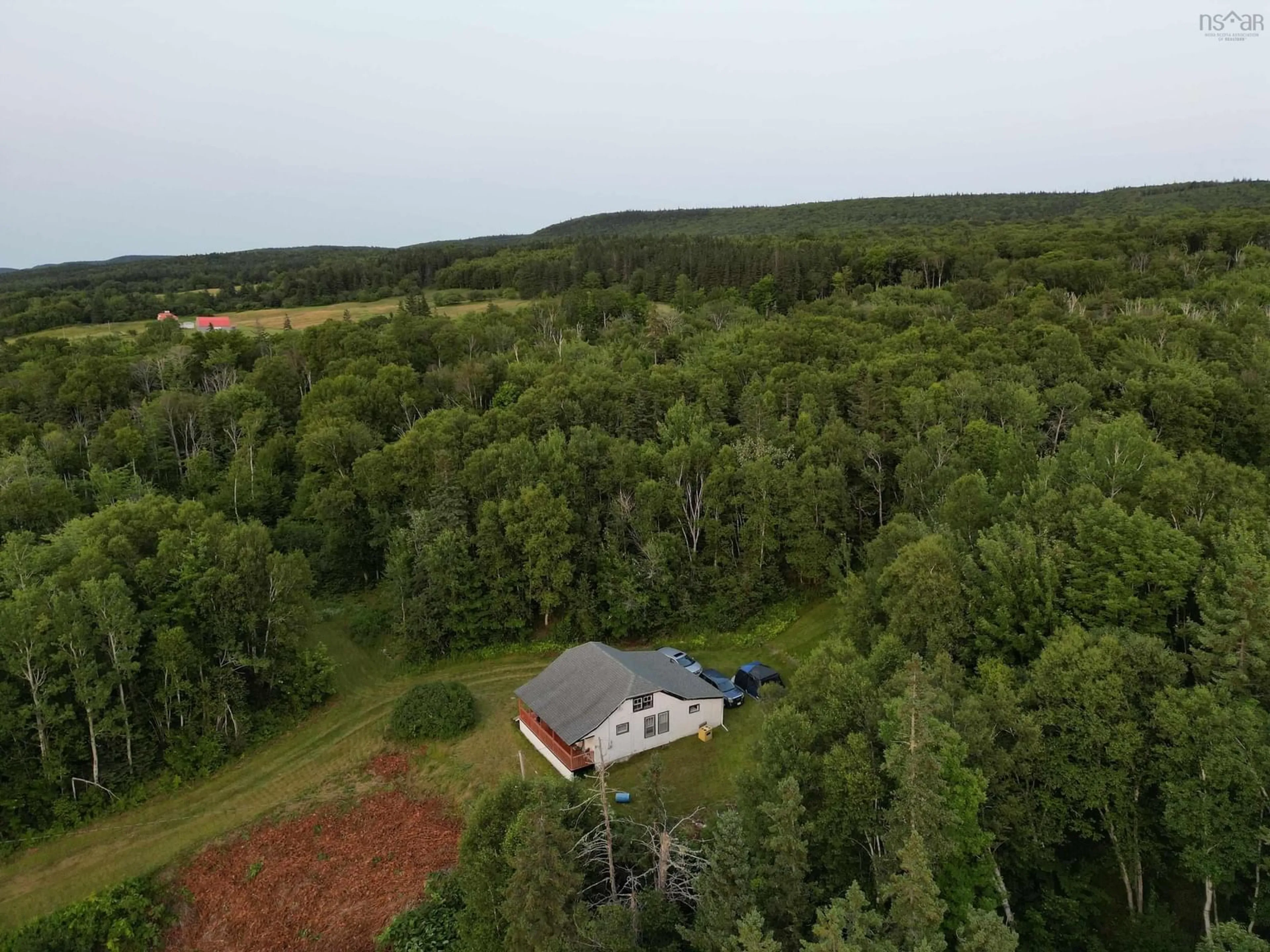 A pic from outside/outdoor area/front of a property/back of a property/a pic from drone, forest/trees view for 7319 223 Hwy, Big Beach Nova Scotia B1T 1M2