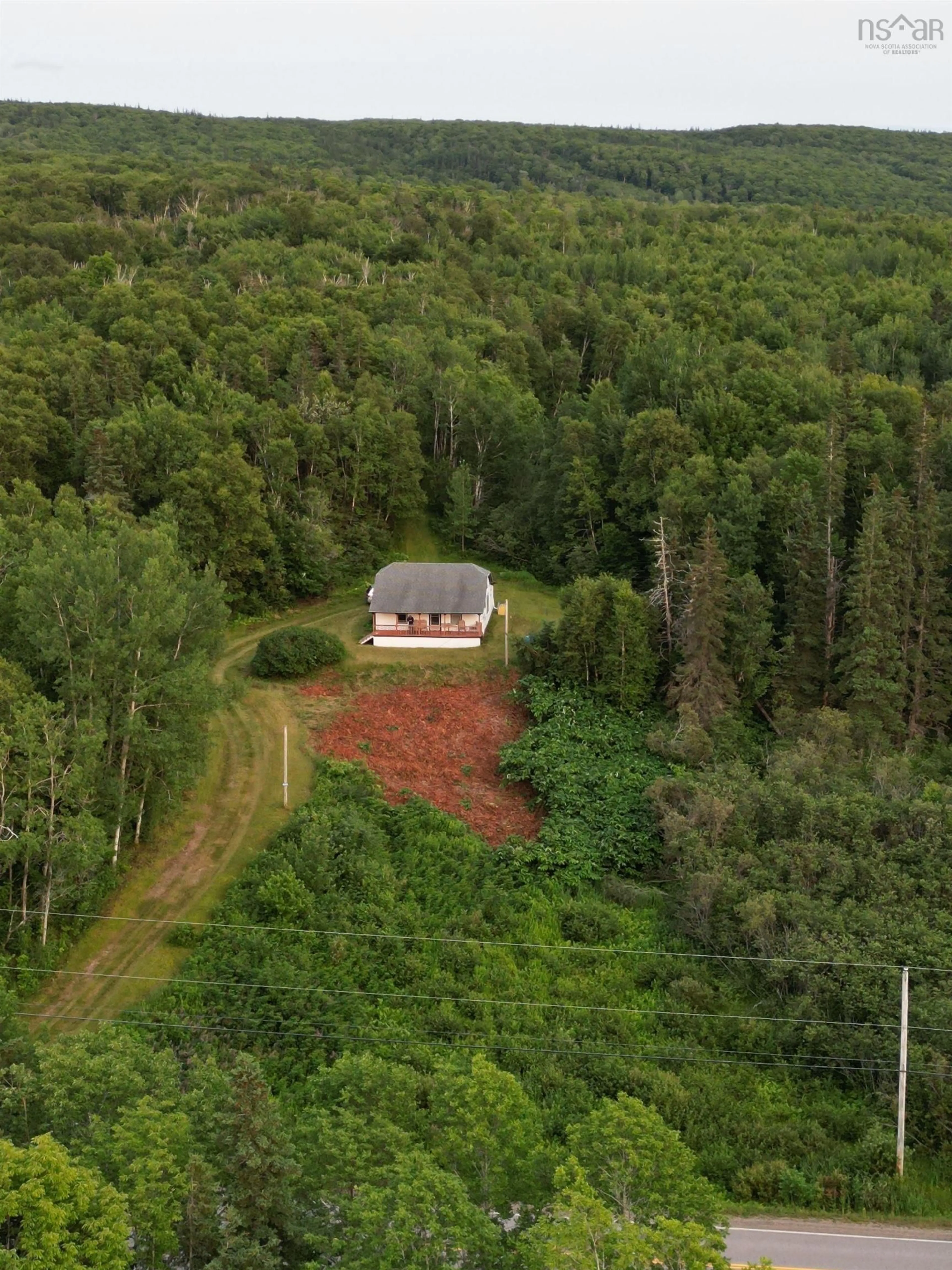 A pic from outside/outdoor area/front of a property/back of a property/a pic from drone, forest/trees view for 7319 223 Hwy, Big Beach Nova Scotia B1T 1M2