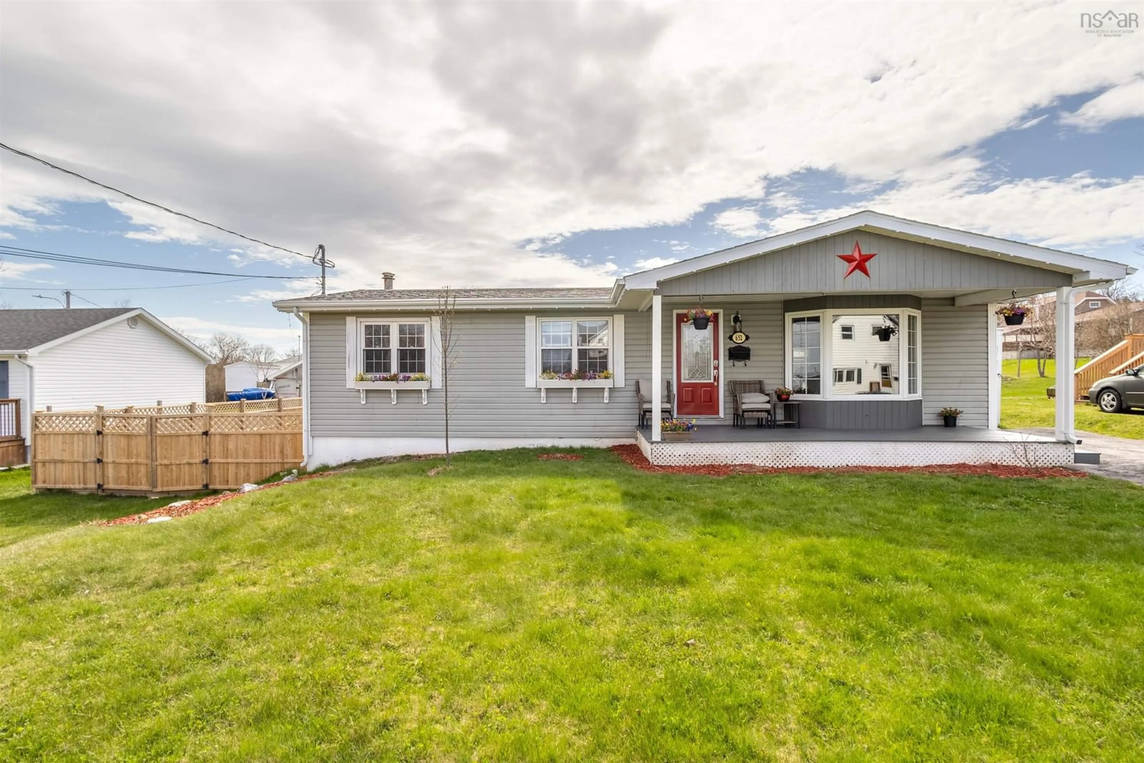 Home with vinyl exterior material, street for 652 Thompson St, New Waterford Nova Scotia B1H 4C6