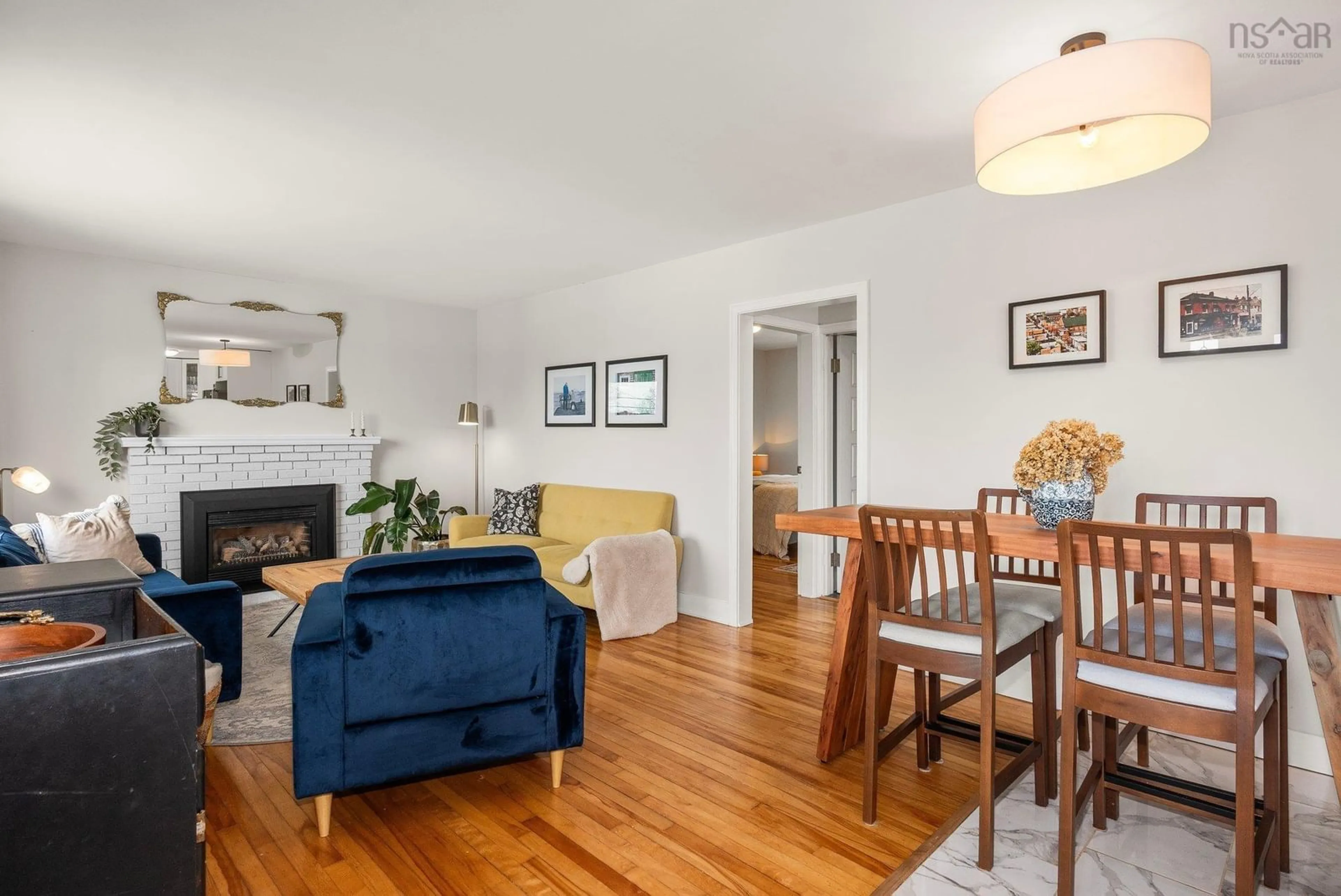 Living room with furniture, wood/laminate floor for 26 Charles St, Dartmouth Nova Scotia B3A 3W6