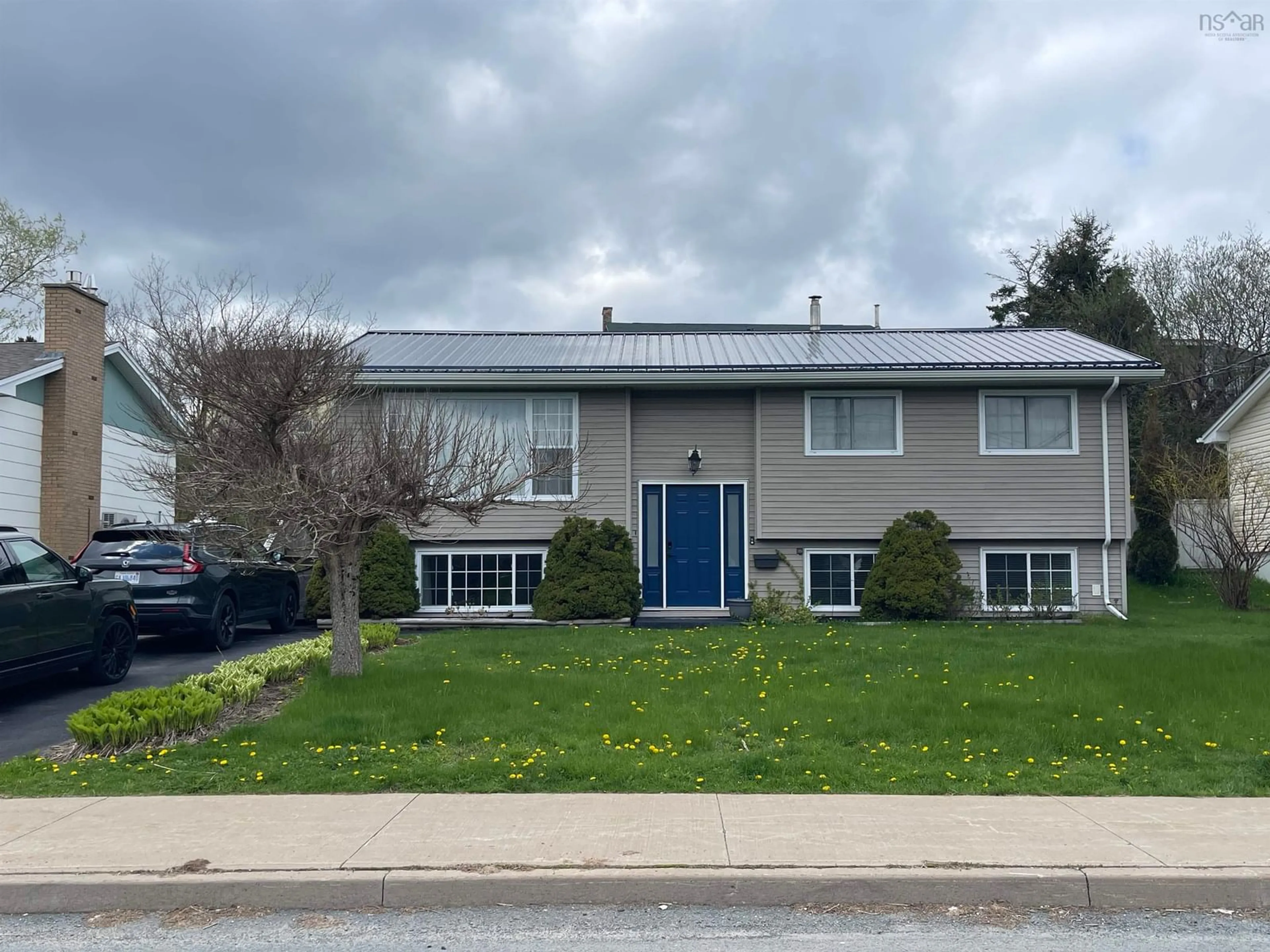 Home with vinyl exterior material, street for 114 Poplar Dr, Cole Harbour Nova Scotia B2W 2K6