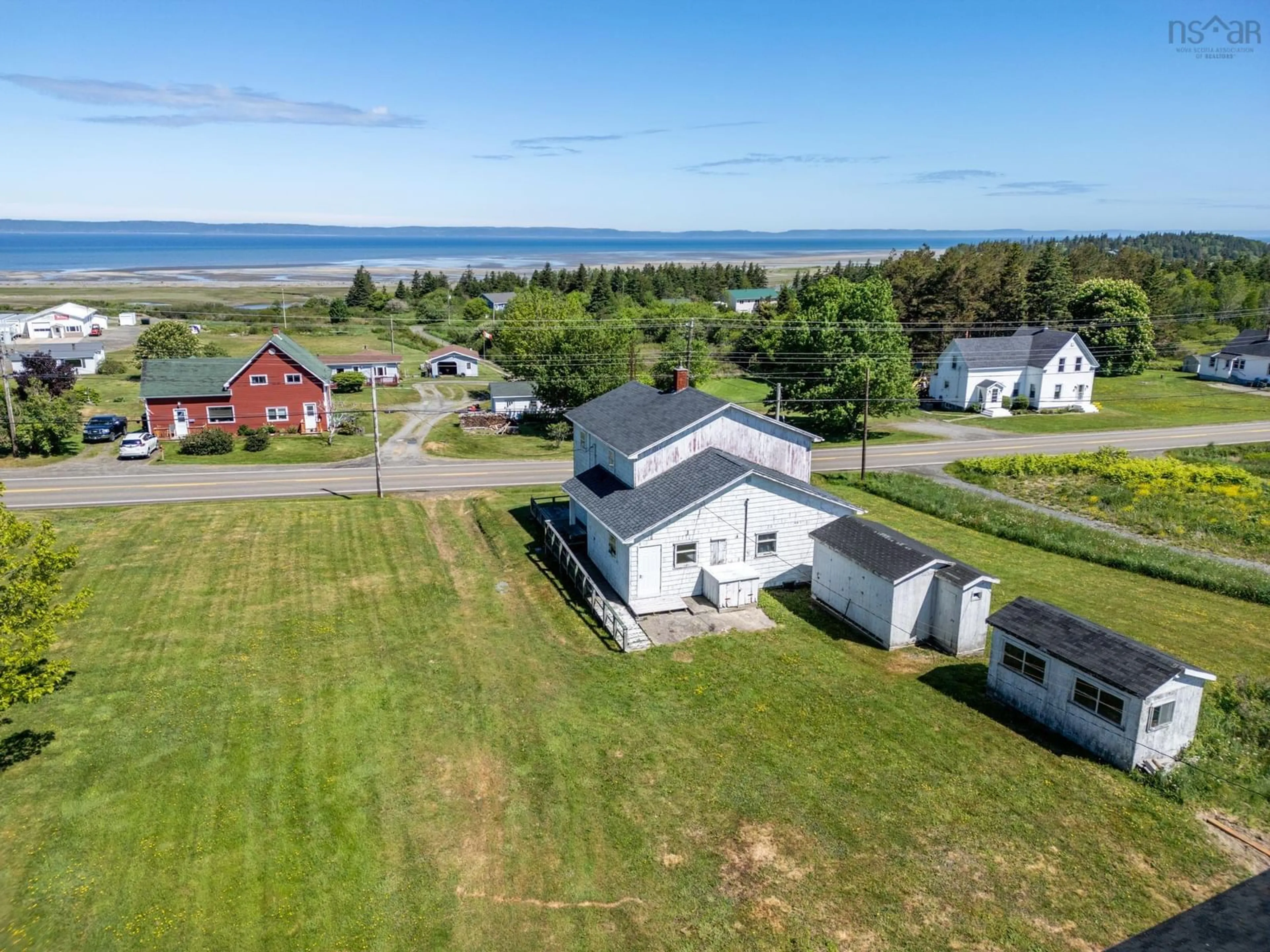A pic from outside/outdoor area/front of a property/back of a property/a pic from drone, water/lake/river/ocean view for 2608 Highway 1, Grosses Coques Nova Scotia B0W 1M0