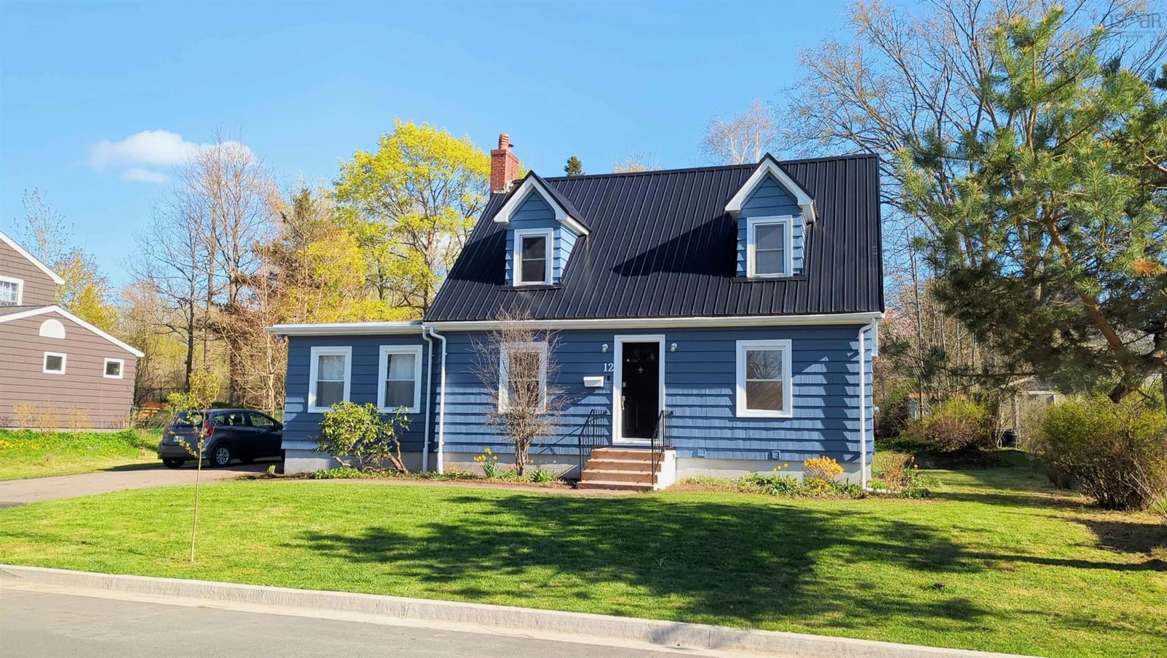 Home with vinyl exterior material, street for 12 Fairfield St, Wolfville Nova Scotia B4P 1L9