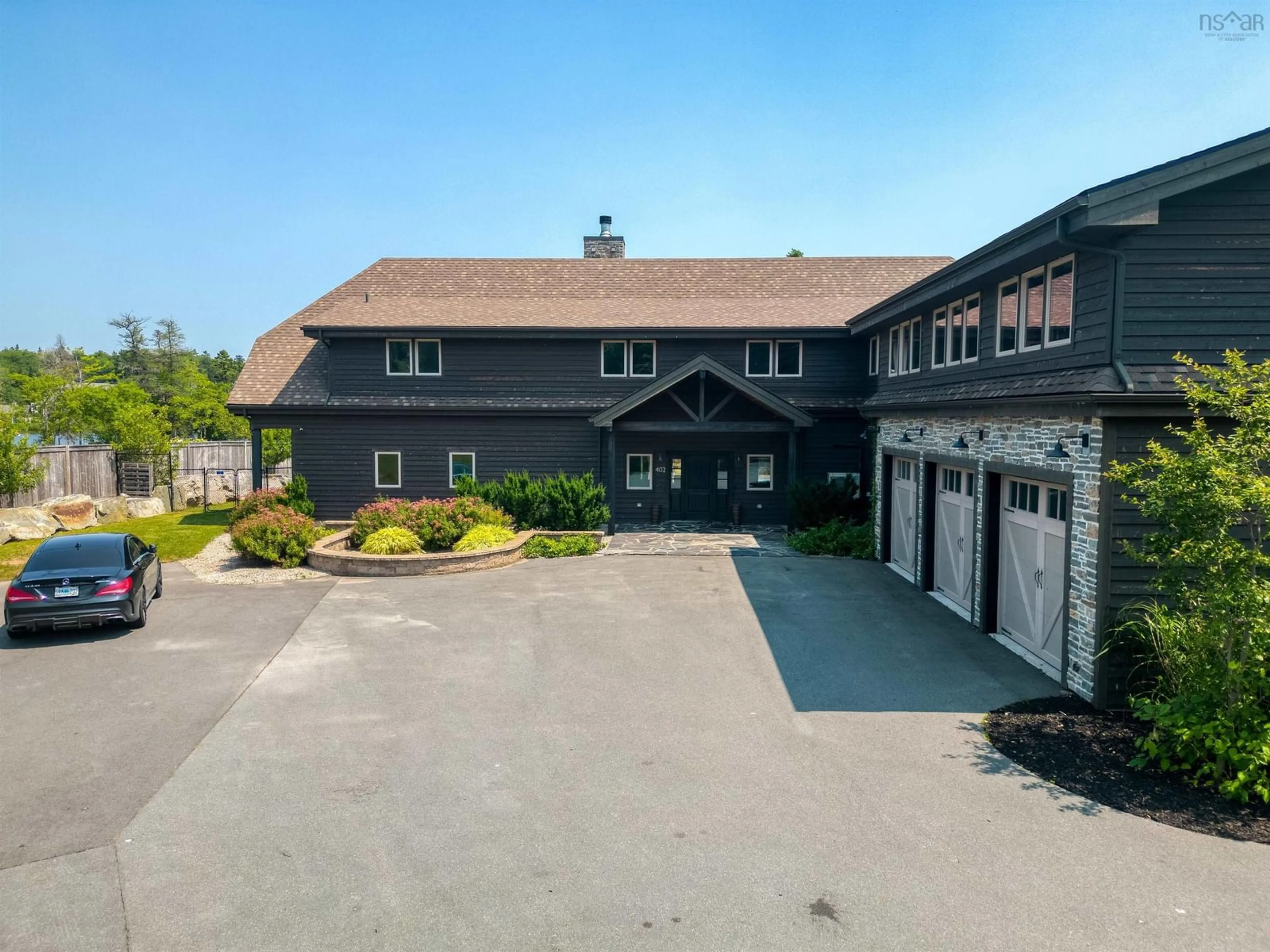A pic from outside/outdoor area/front of a property/back of a property/a pic from drone, building for 402 Lochmoor Lane, Lake Loon Nova Scotia B2W 6C8