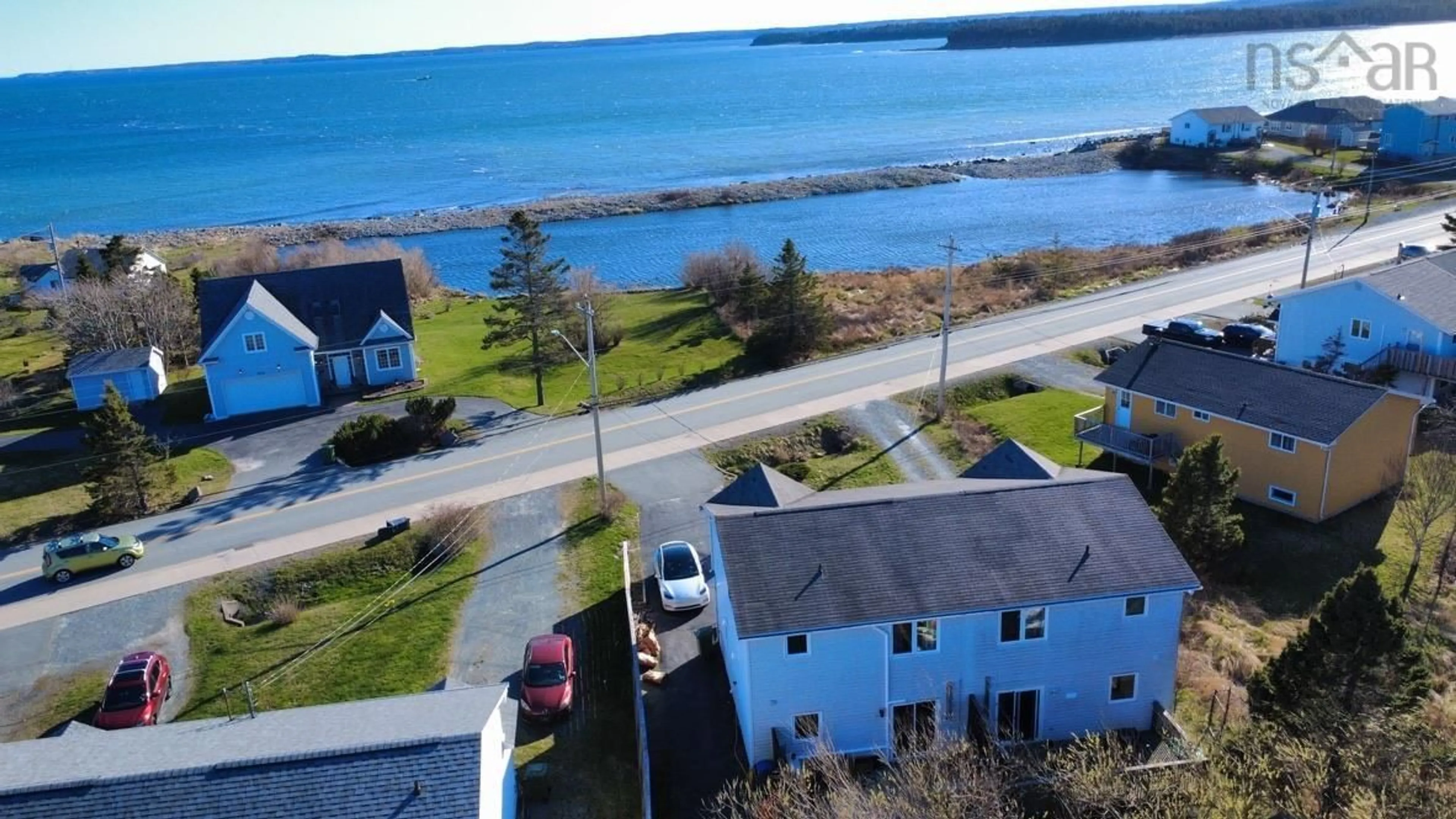 A pic from outside/outdoor area/front of a property/back of a property/a pic from drone, water/lake/river/ocean view for 1936 Shore Rd, Eastern Passage Nova Scotia B3G 1G8