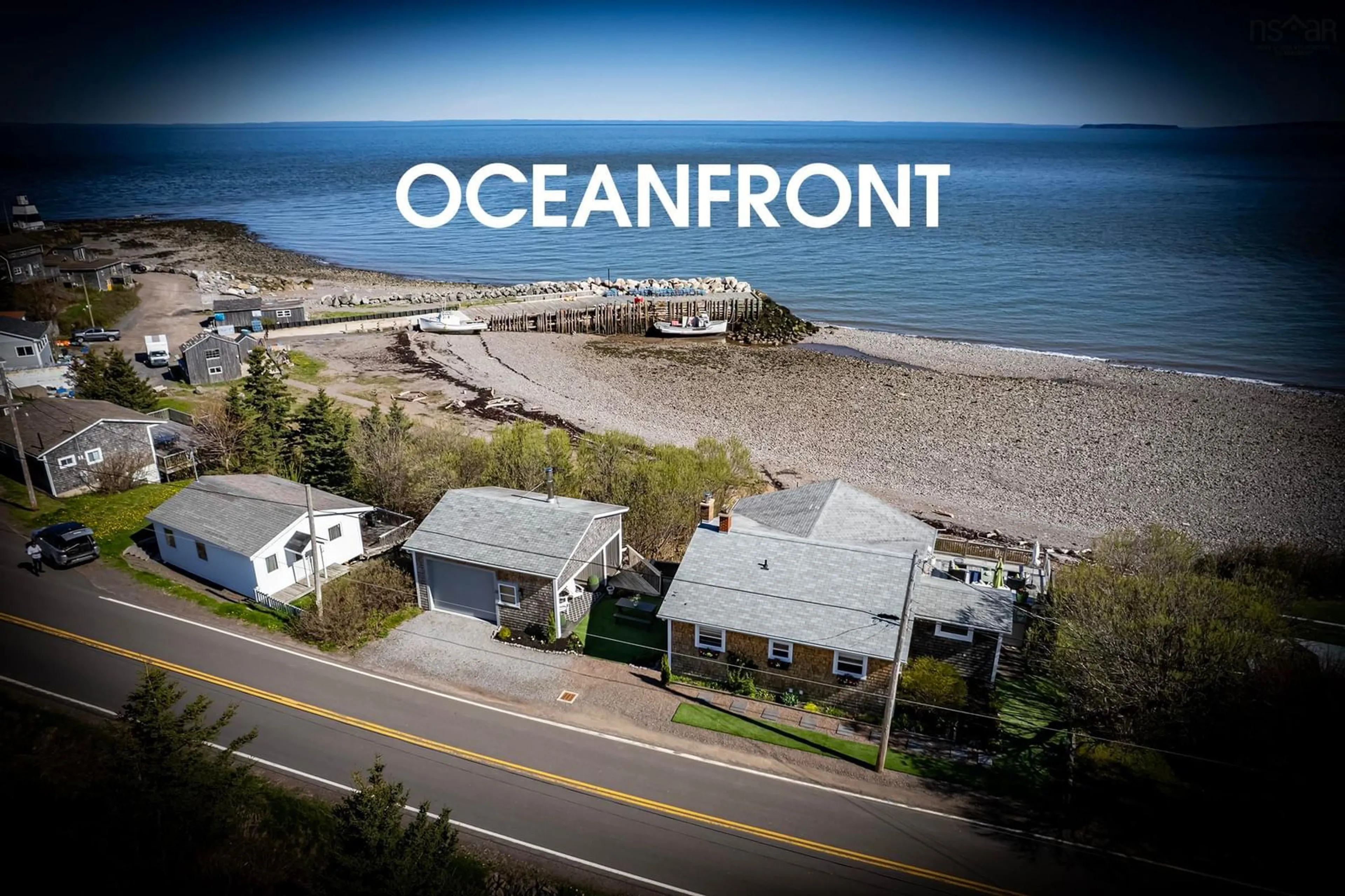 A pic from outside/outdoor area/front of a property/back of a property/a pic from drone, water/lake/river/ocean view for 37 Seaman St, Margaretsville Nova Scotia B0S 1N0