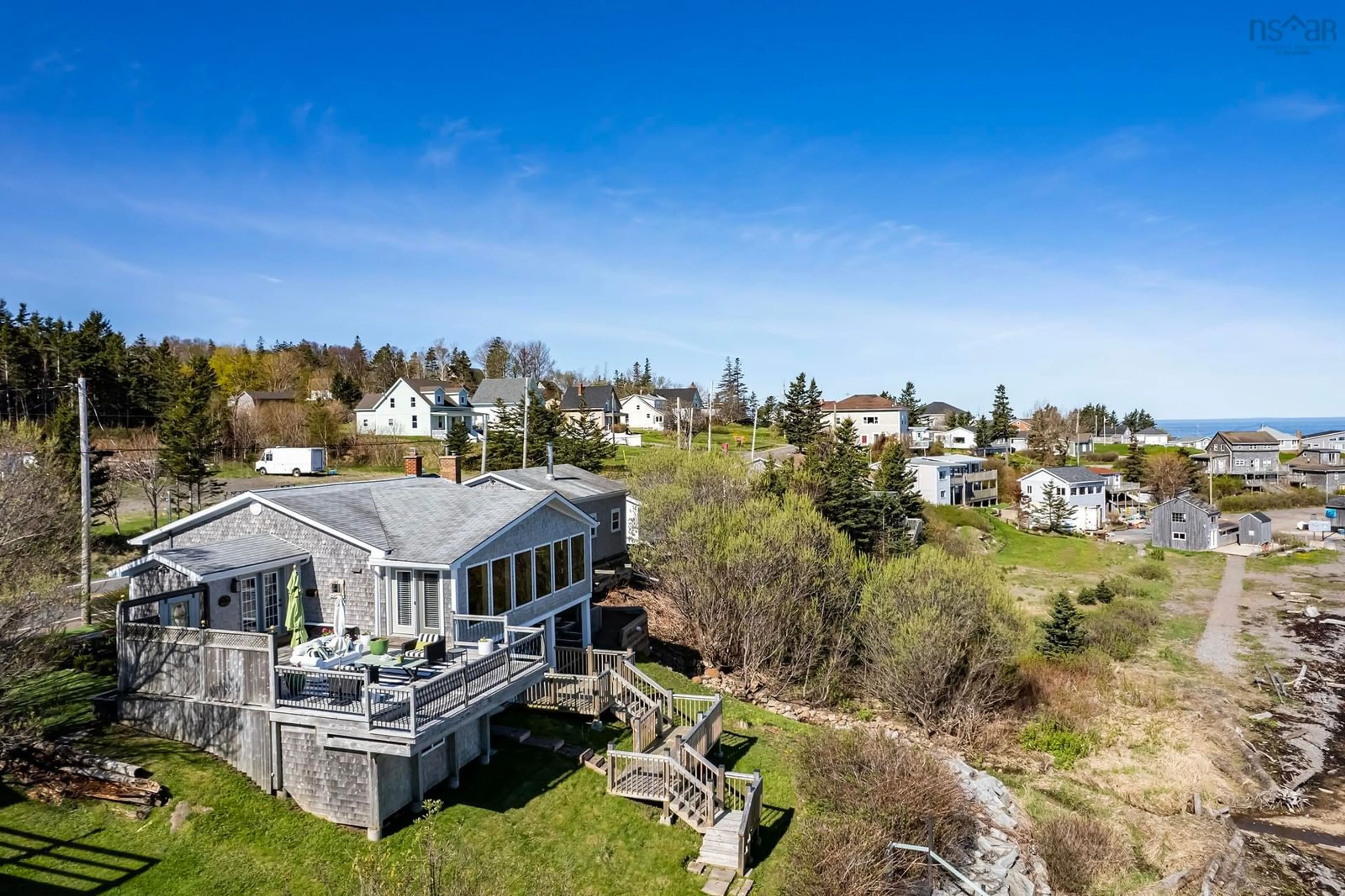 A pic from outside/outdoor area/front of a property/back of a property/a pic from drone, water/lake/river/ocean view for 37 Seaman St, Margaretsville Nova Scotia B0S 1N0