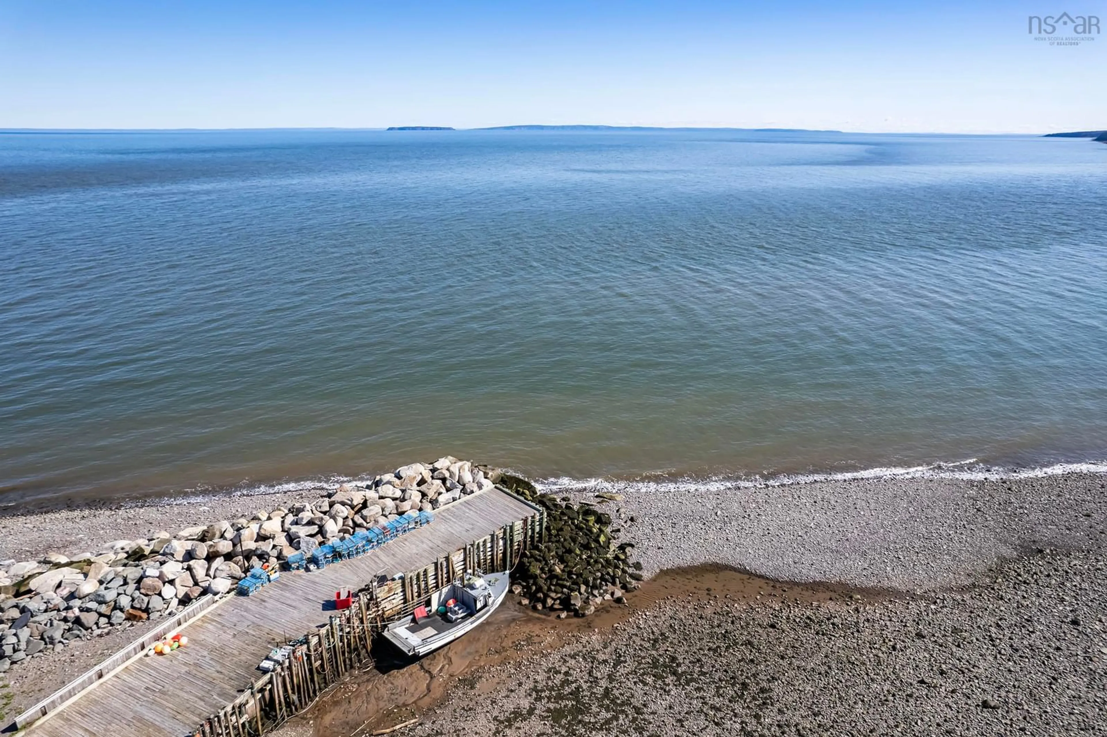 A pic from outside/outdoor area/front of a property/back of a property/a pic from drone, water/lake/river/ocean view for 37 Seaman St, Margaretsville Nova Scotia B0S 1N0
