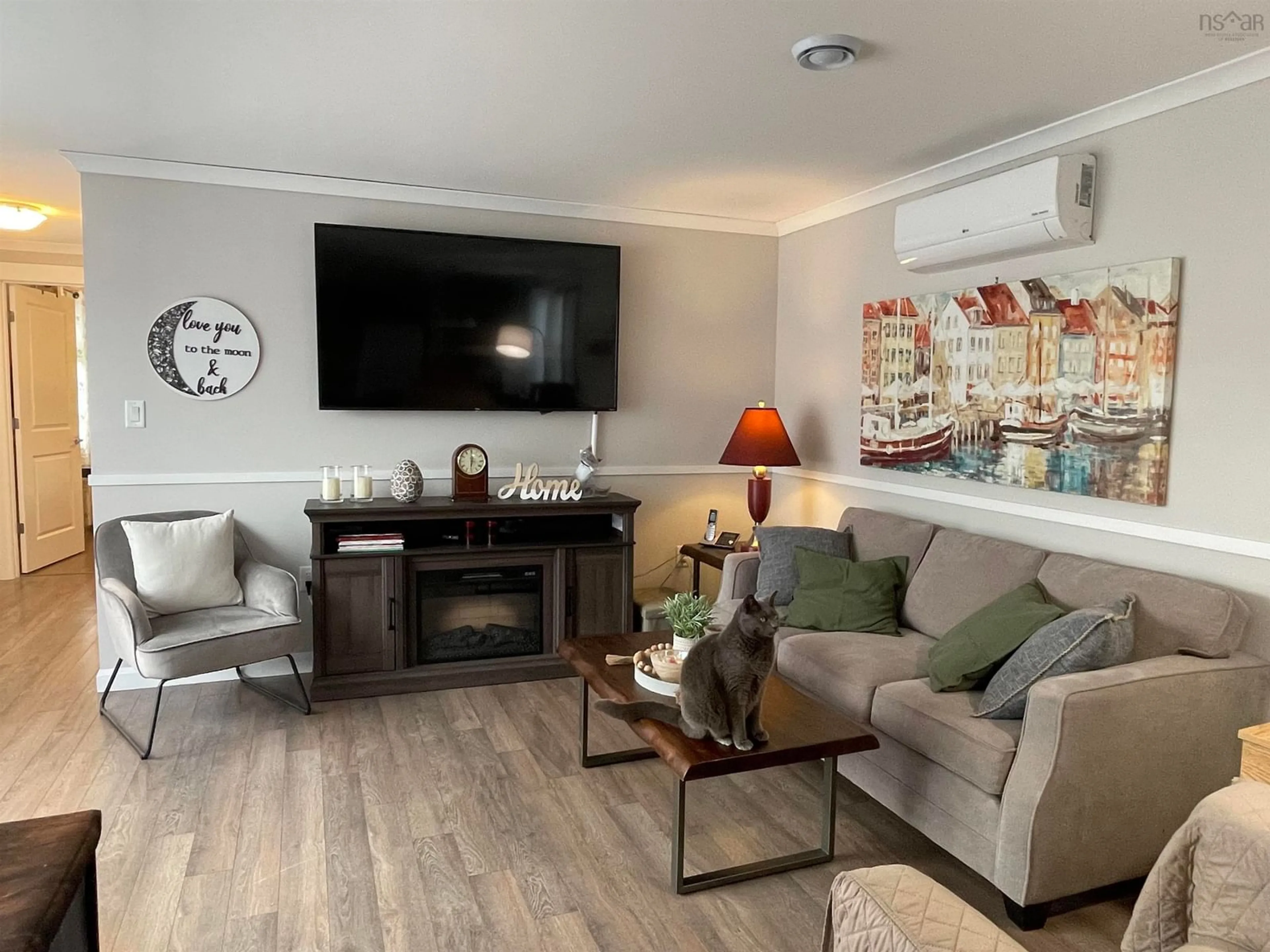 Living room with furniture, wood/laminate floor for 5 Sea Glass Dr, Simms Settlement Nova Scotia B0J 1T0