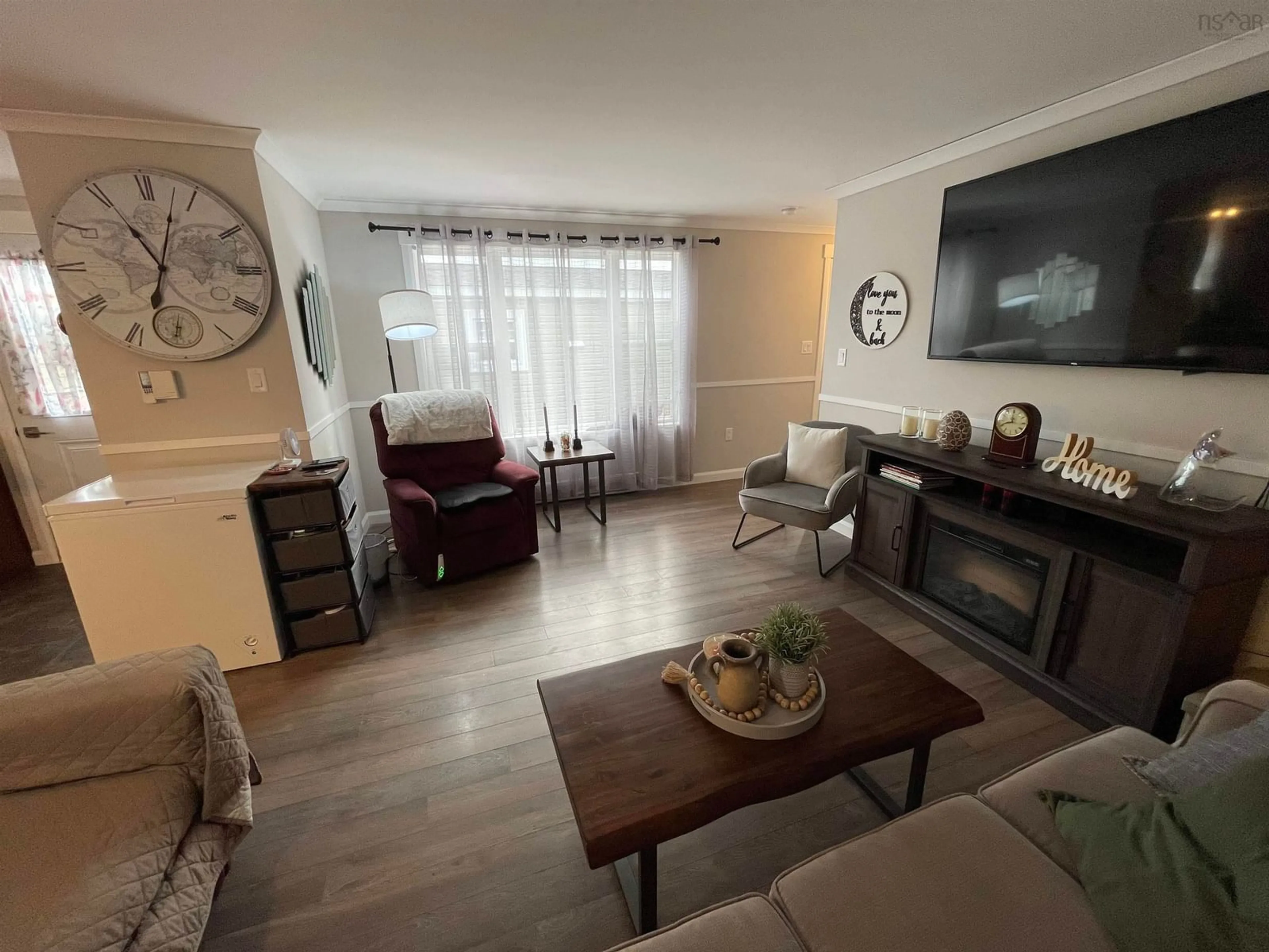 Living room with furniture, wood/laminate floor for 5 Sea Glass Dr, Simms Settlement Nova Scotia B0J 1T0