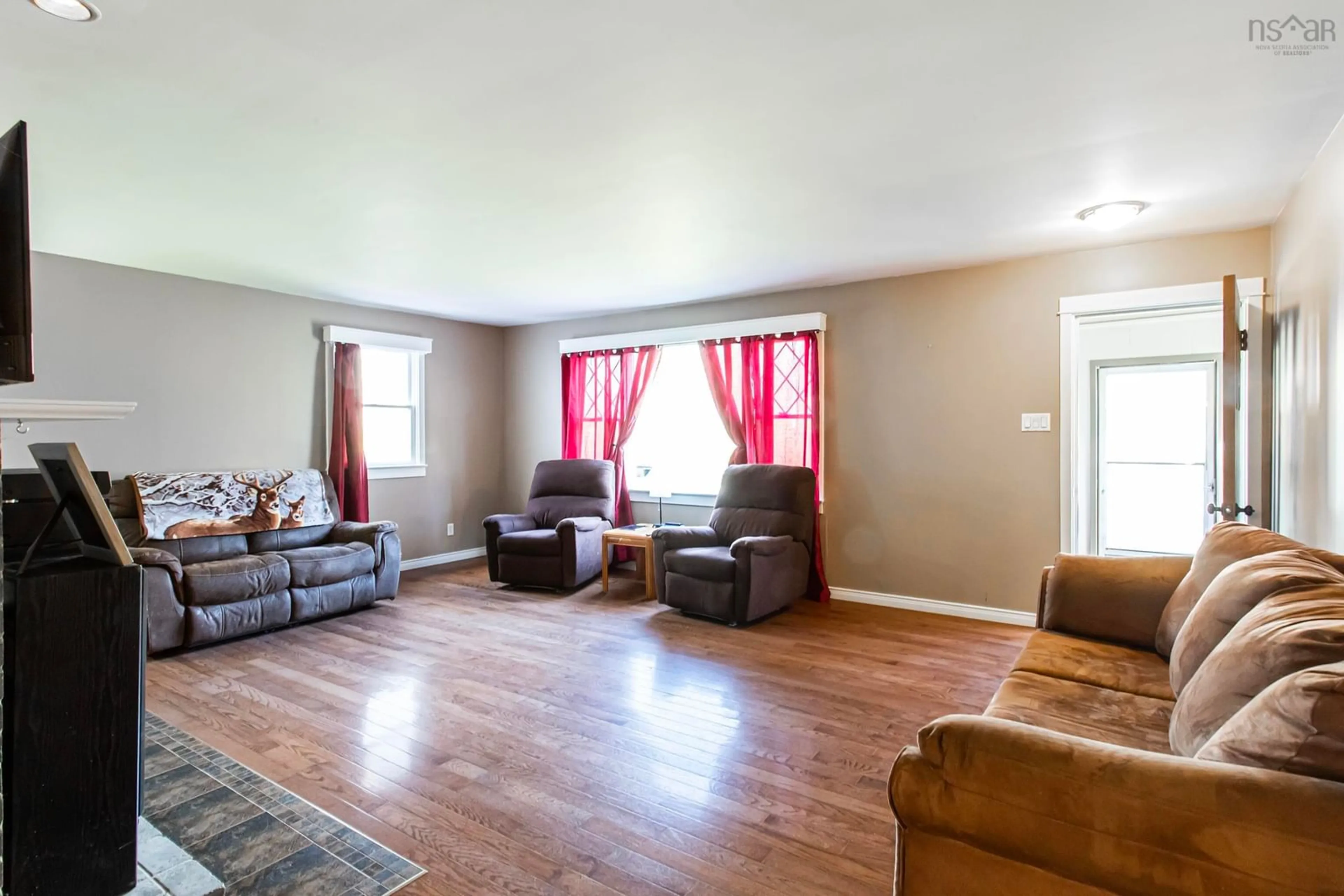 Living room with furniture, wood/laminate floor for 12363 Highway 1, Brickton Nova Scotia B0S 1P0