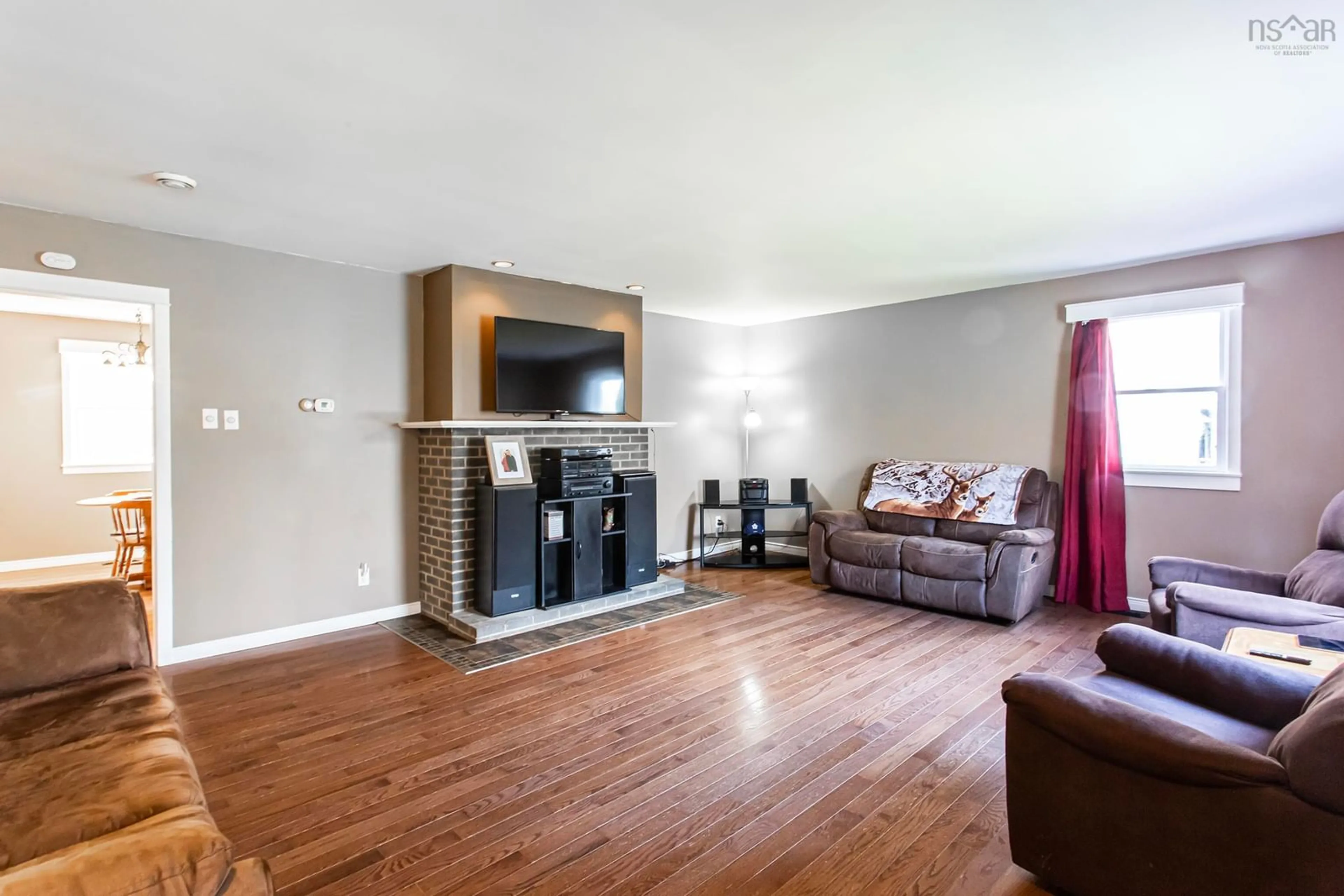 Living room with furniture, wood/laminate floor for 12363 Highway 1, Brickton Nova Scotia B0S 1P0