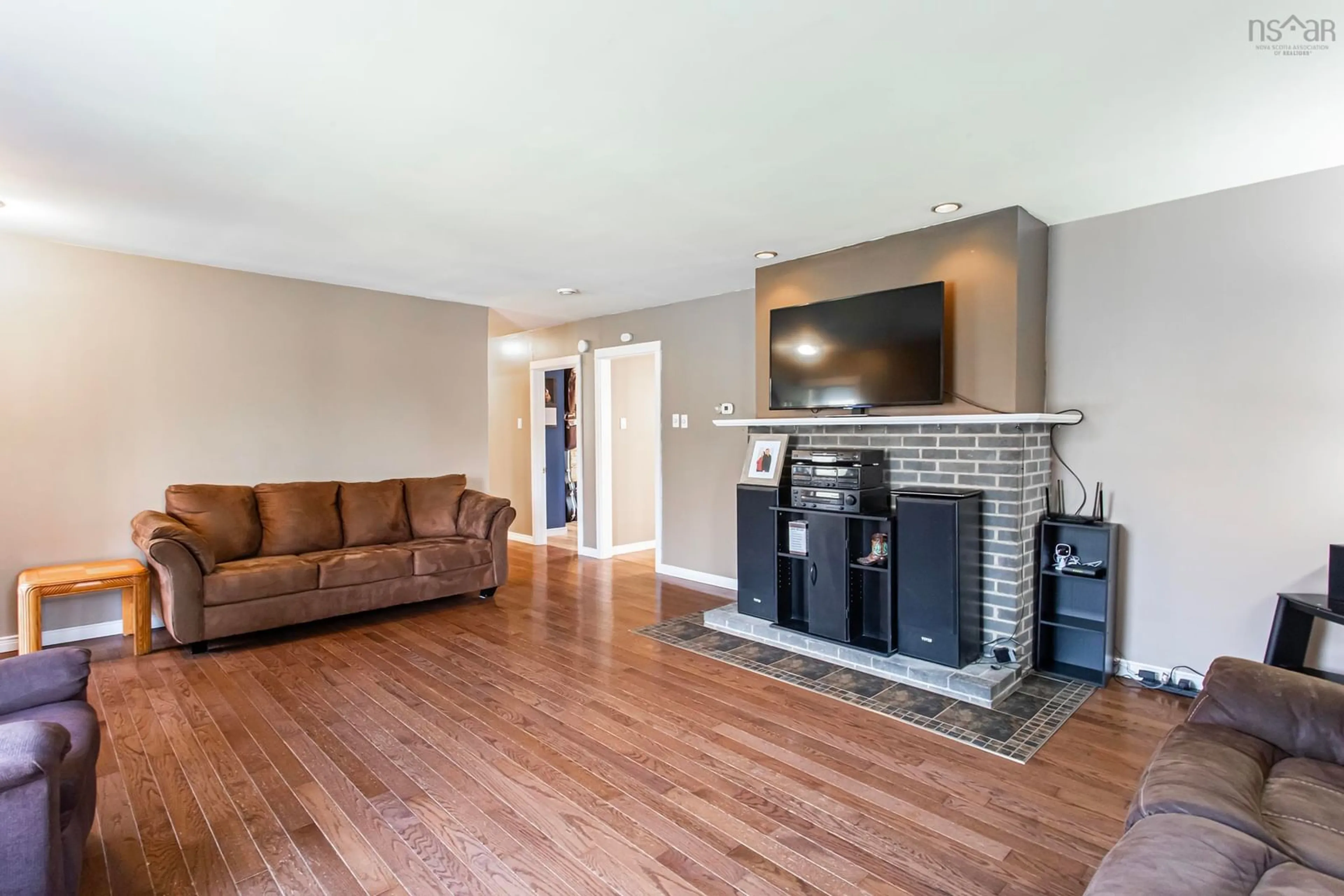 Living room with furniture, wood/laminate floor for 12363 Highway 1, Brickton Nova Scotia B0S 1P0