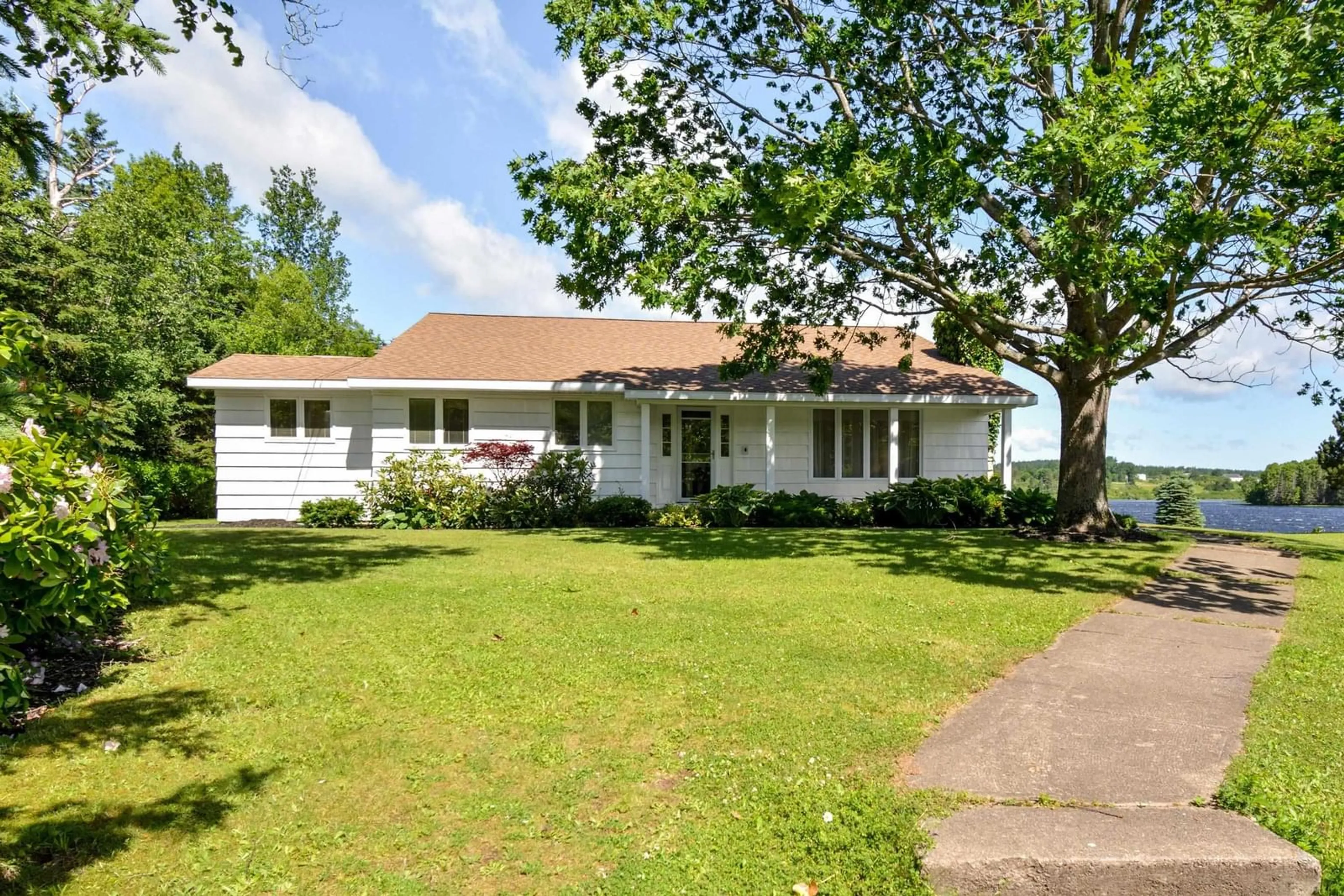 A pic from outside/outdoor area/front of a property/back of a property/a pic from drone, street for 1900 Kings Rd, Sydney River Nova Scotia B1P 6H1