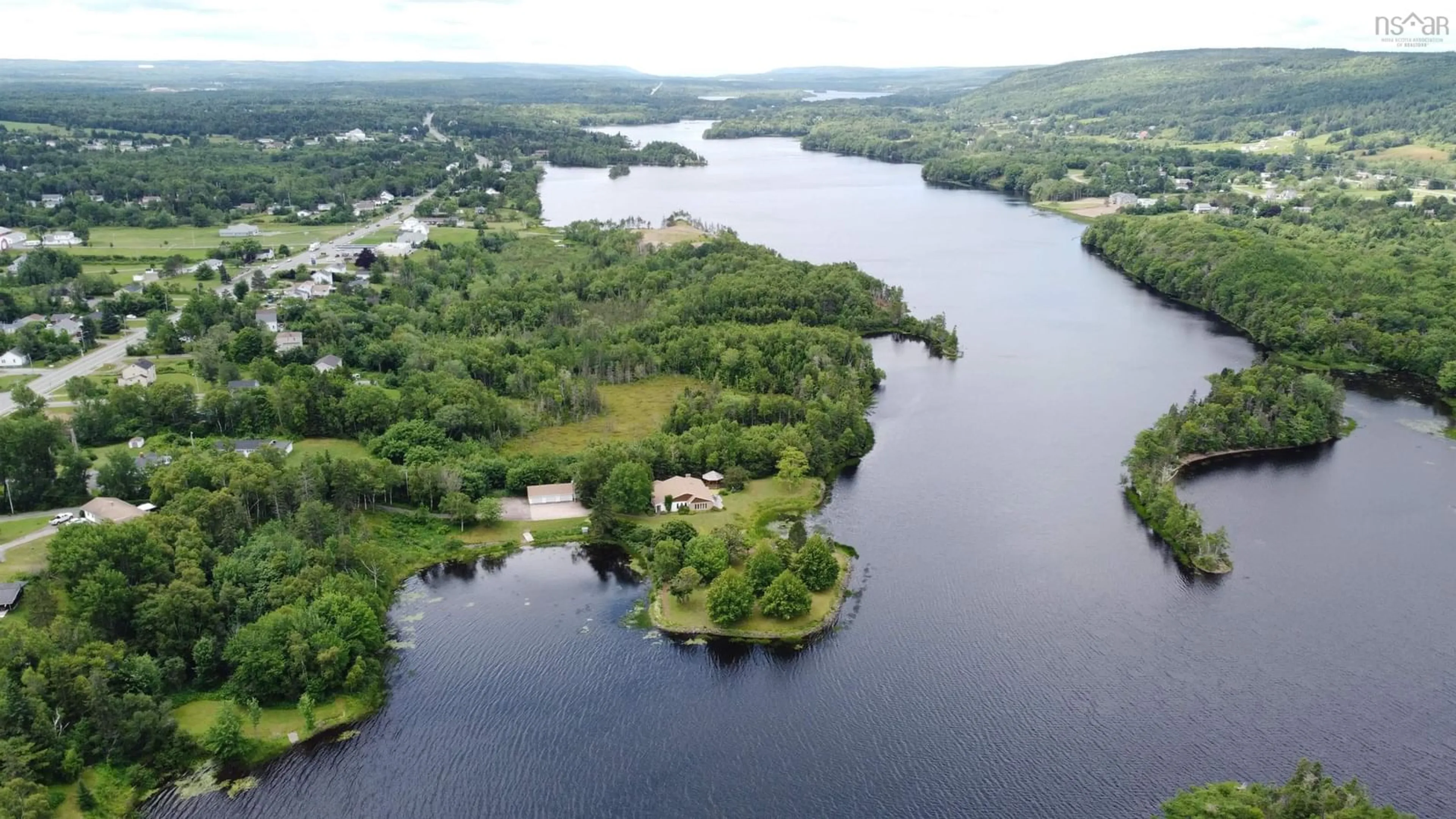 A pic from outside/outdoor area/front of a property/back of a property/a pic from drone, water/lake/river/ocean view for 1900 Kings Rd, Sydney River Nova Scotia B1P 6H1